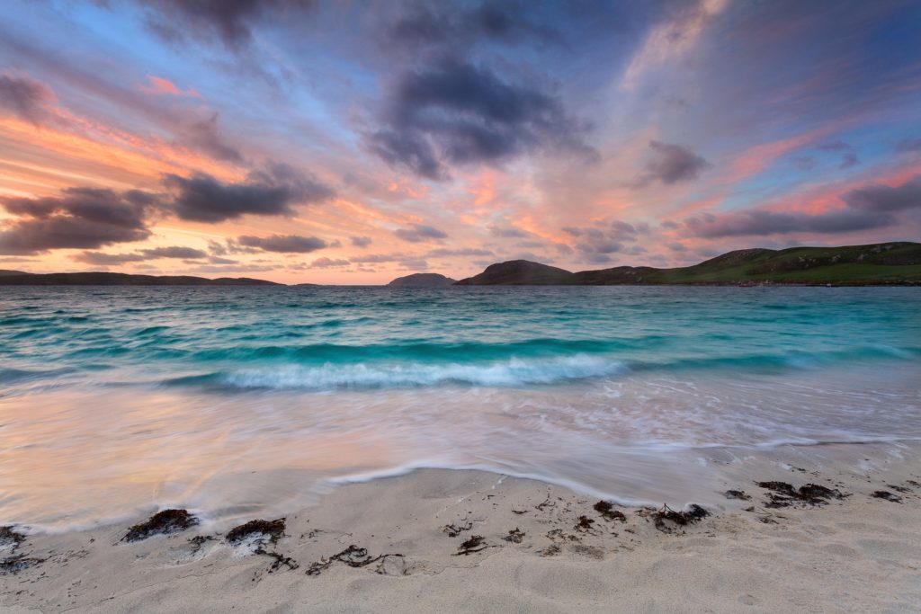 Stunning sunrise over Vatersay beach, Outer Hebrides.