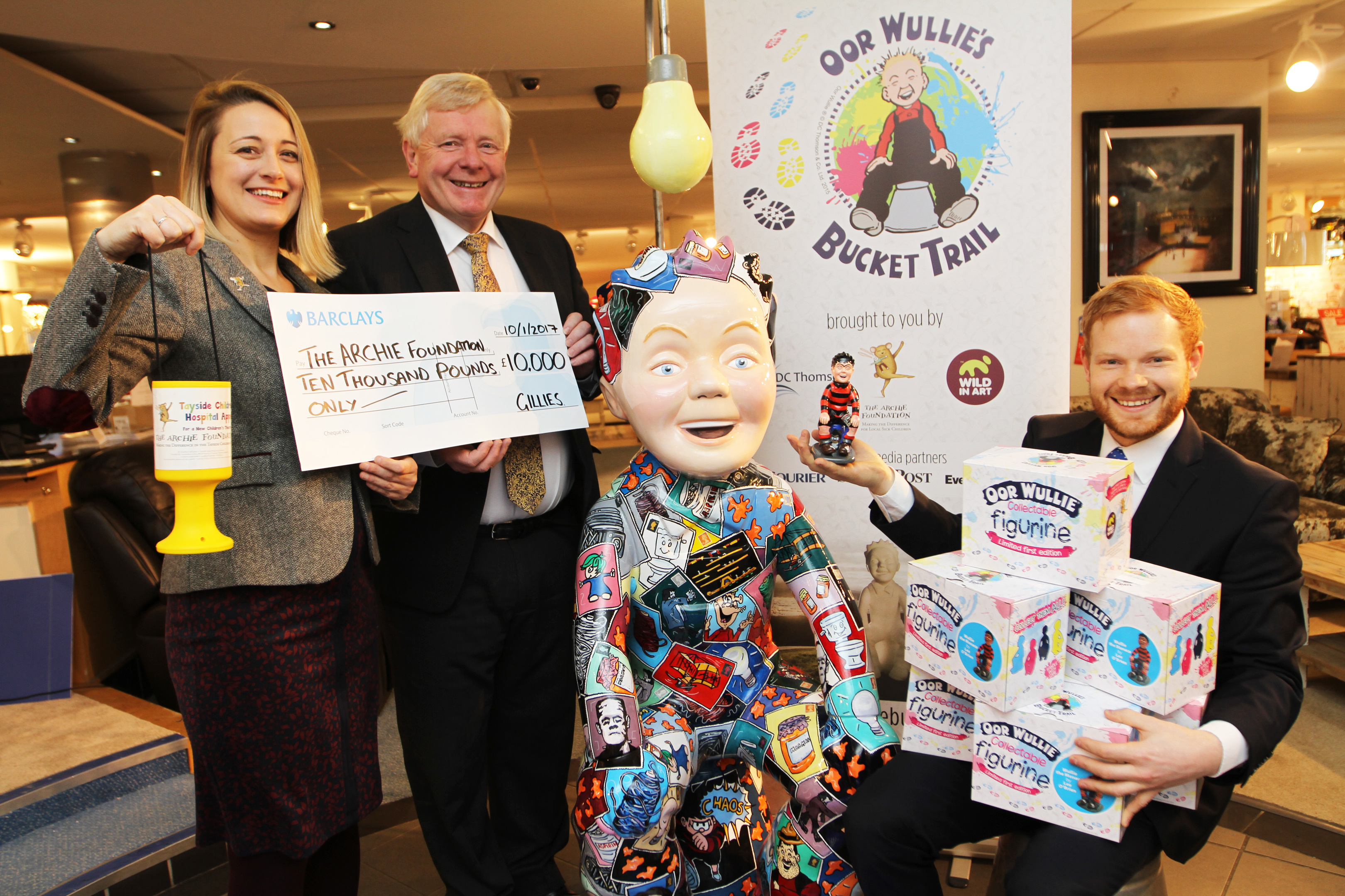 Cassie Thompson, Archies director of fundraising, Ian Philp, managing director of Gillies, and Ewan Philp, marketing director for Gillies., with the £10,000 cheque.