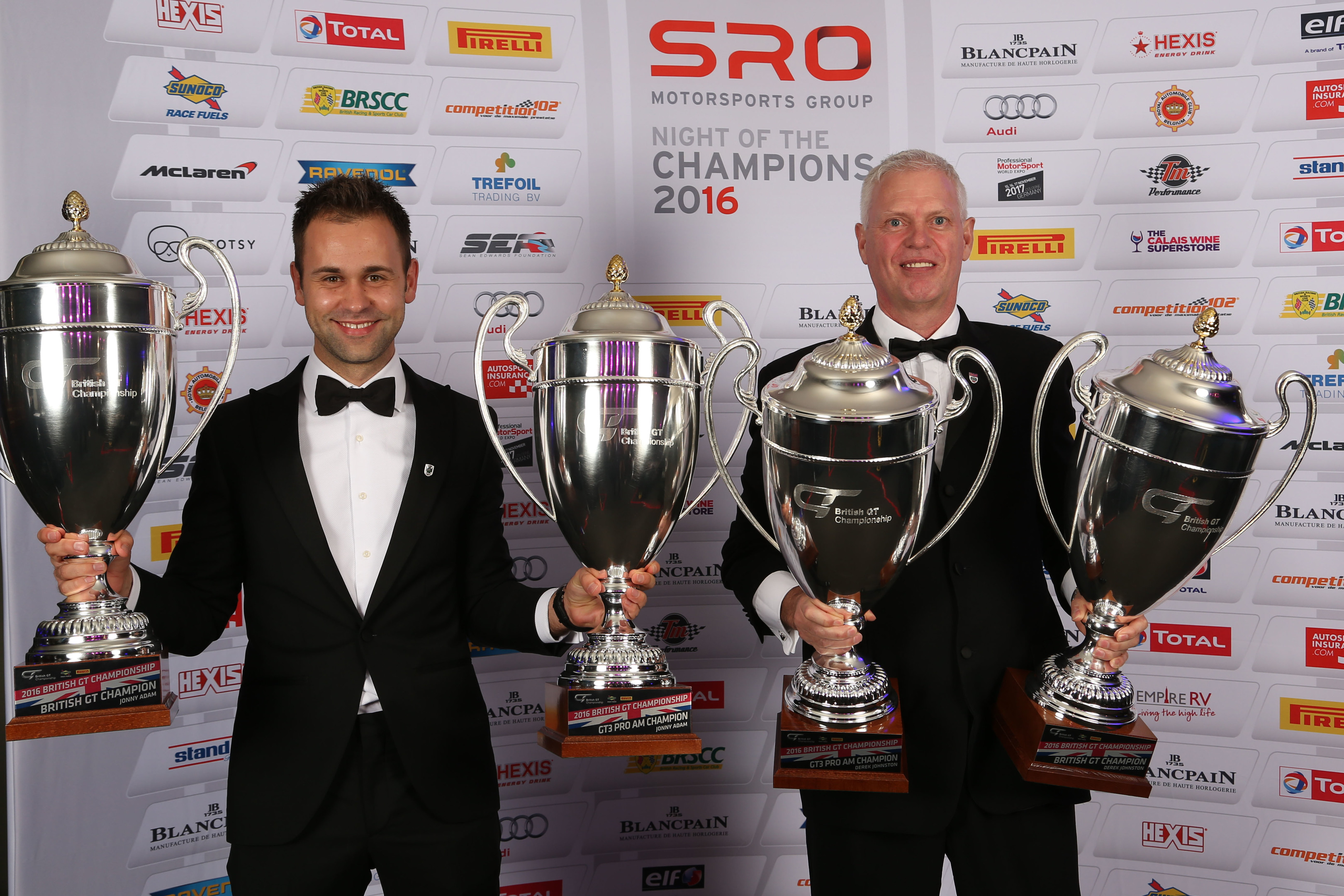 Jonny Adam and TF Sport teammate Derek Johnston with the 2016 British GT silverware