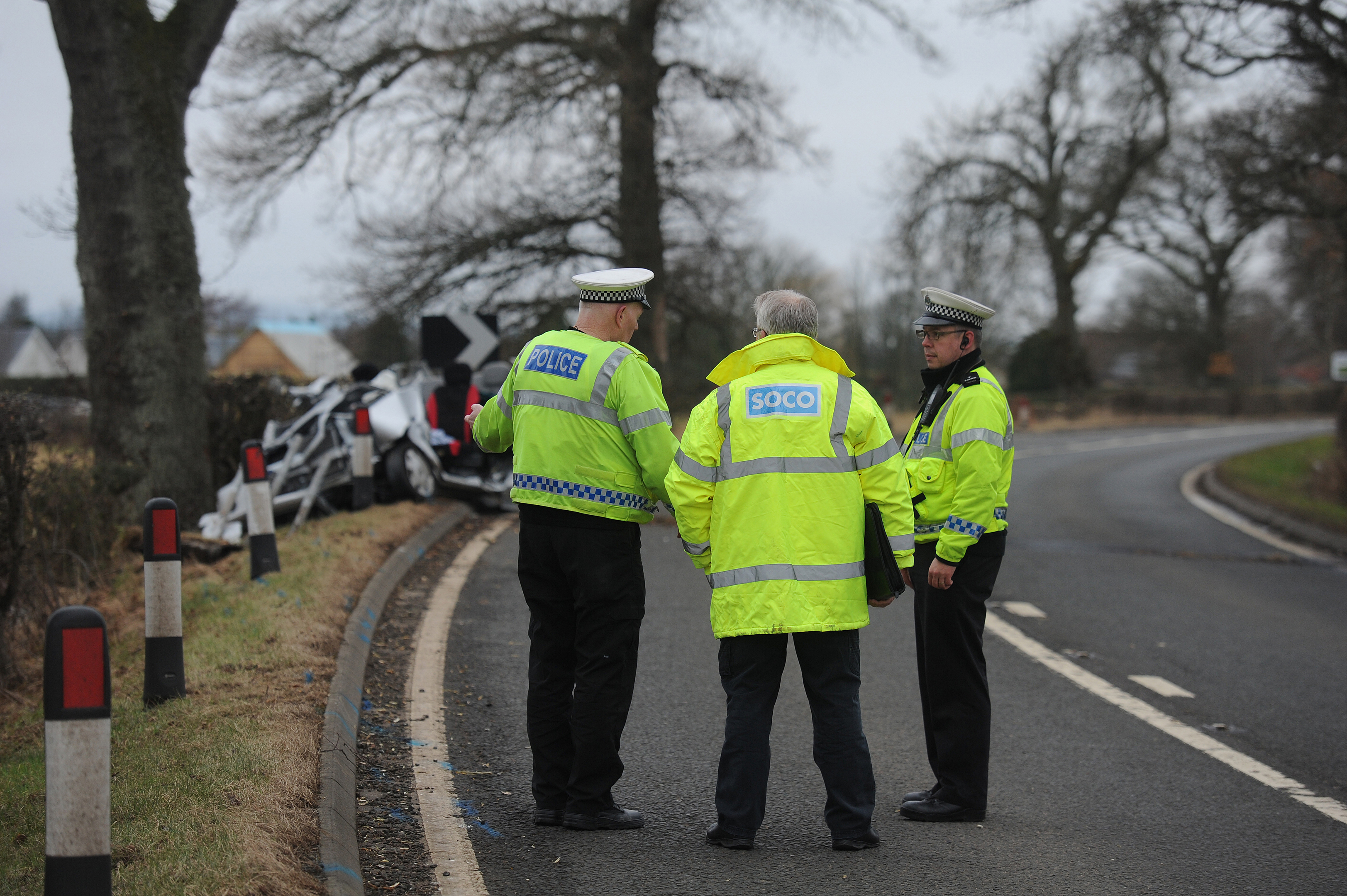 Police survey the scene of the incident at Fowlis Wester, Methven