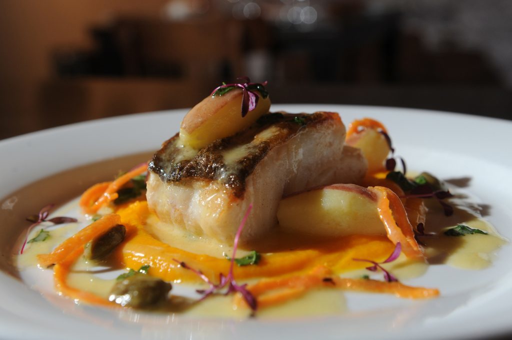 Pan friend fillet of cod, carrot and cardomom puree with capers and coriander.