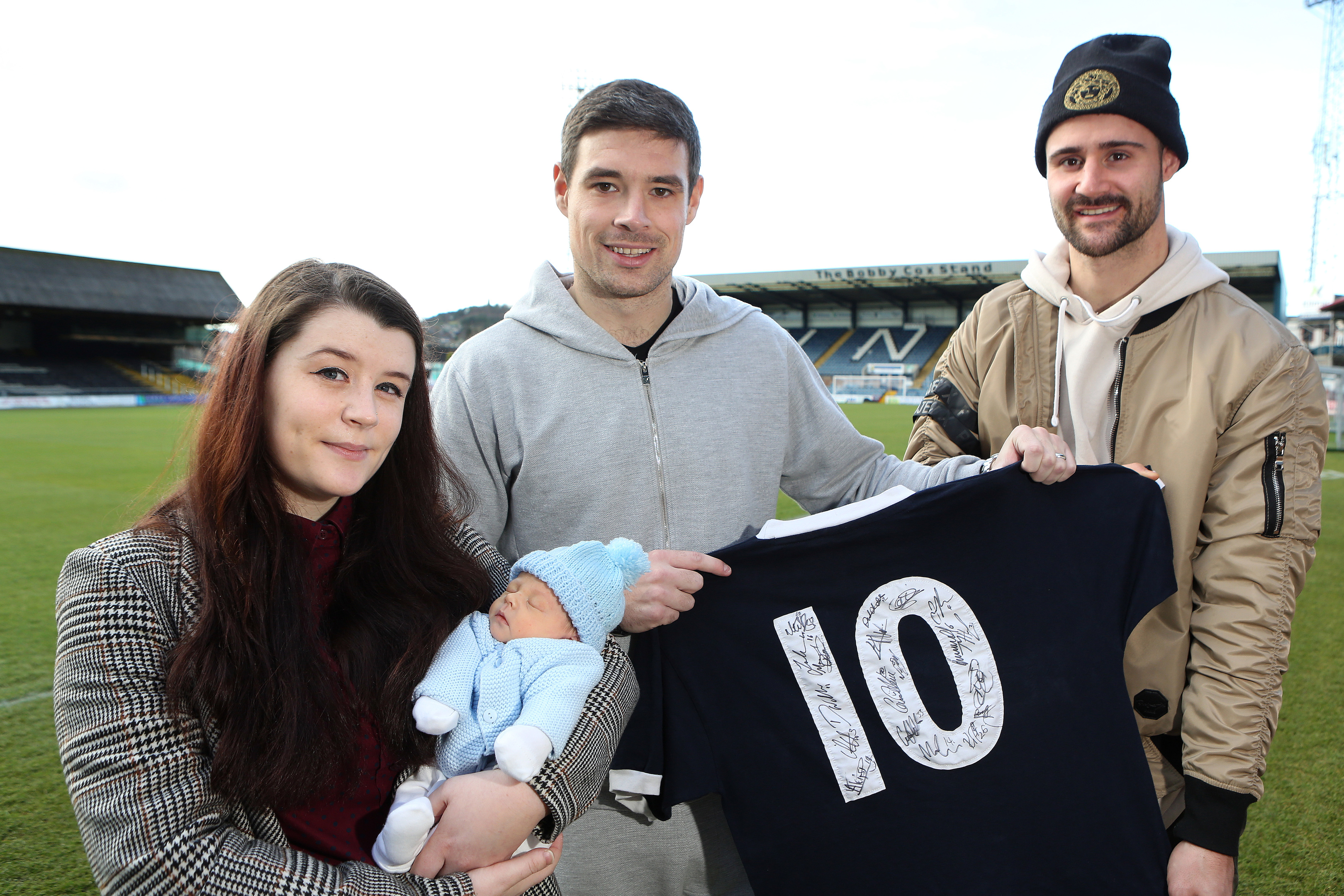 A delighted Megan with Dundee defender Darren O'Dea and striker Marcus Haber.