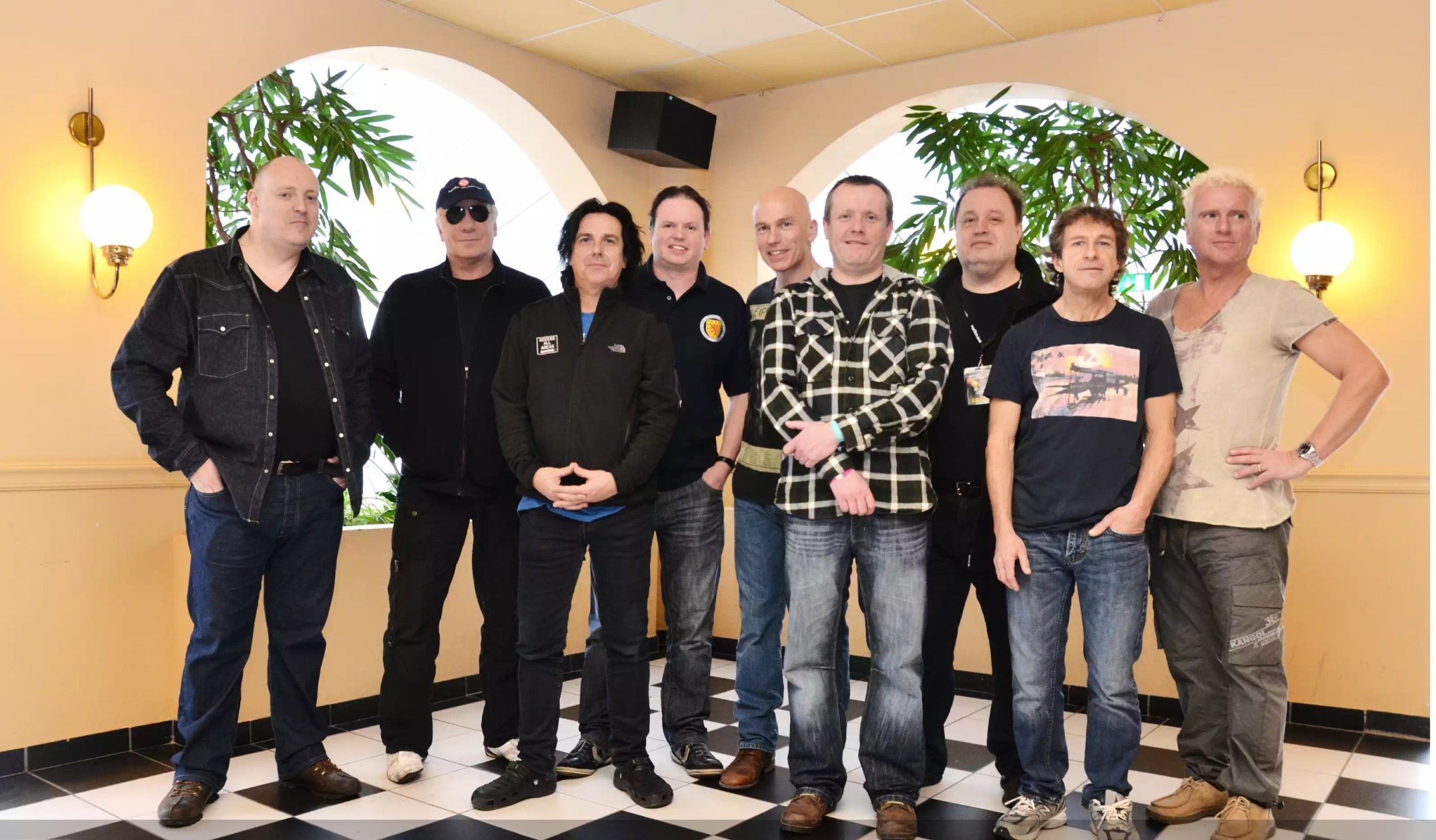 Kevin O'Neil, left, and friends met members of Marillion three years ago.