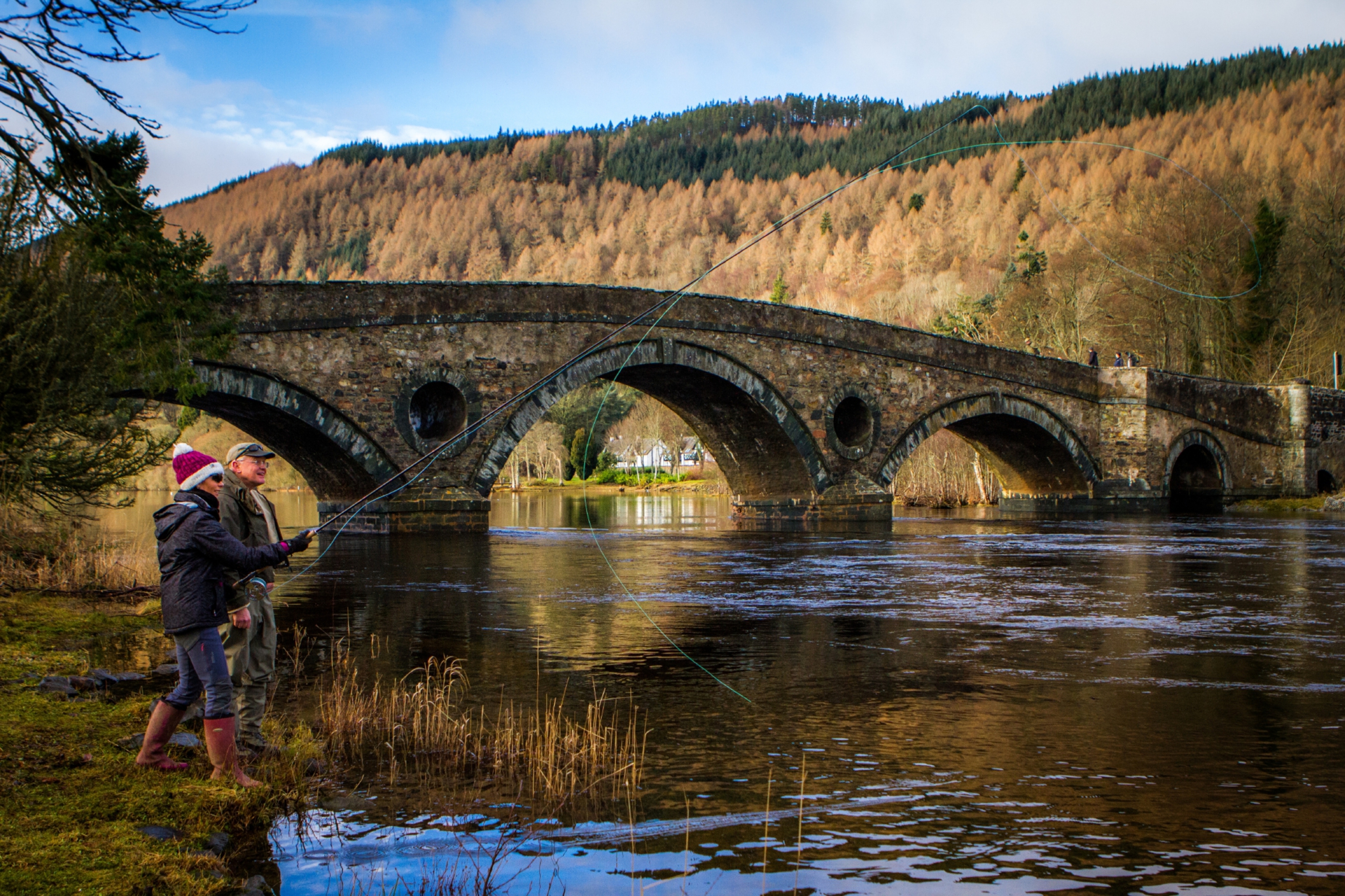 Mark Bowler showing Gayle Ritchie how to fly fish on the River Tay at Kenmore.