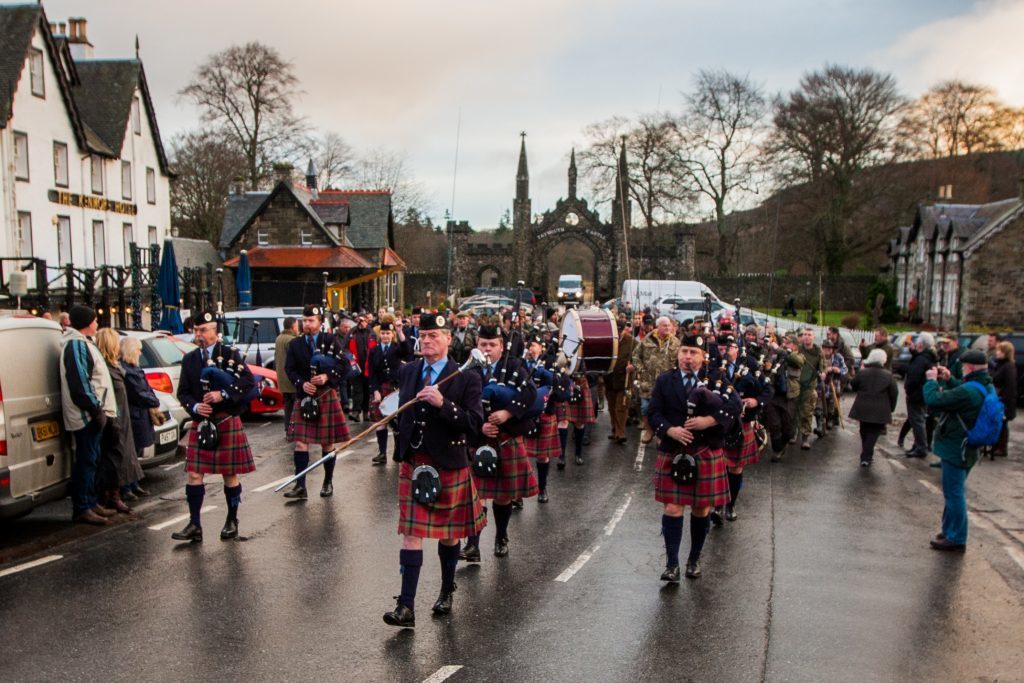 The parade to the river led by Vale of Atholl Pipe Band