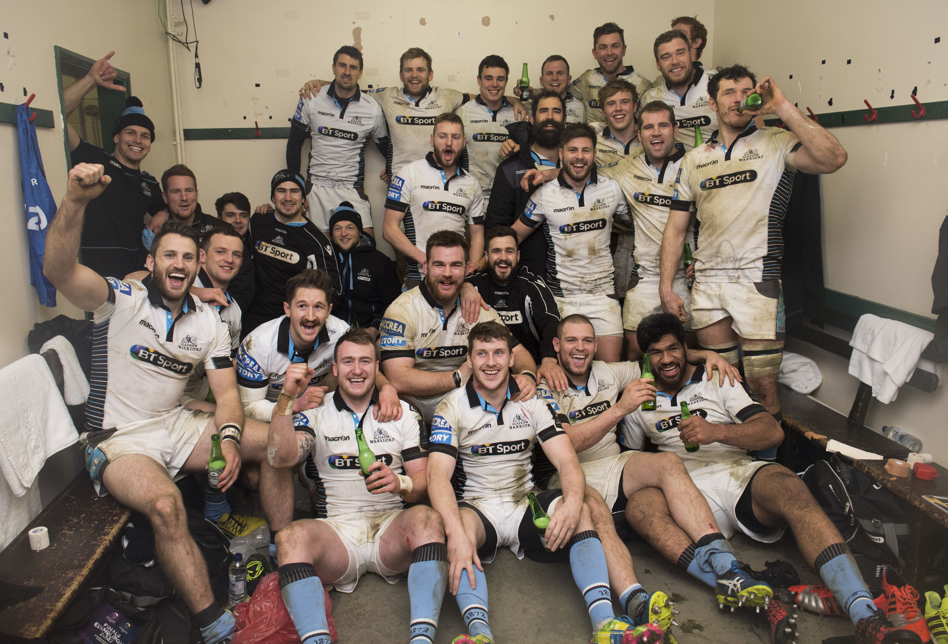 Glasgow celebrate in their Welford Road dressing room after their 43-0 rout of Leicester.