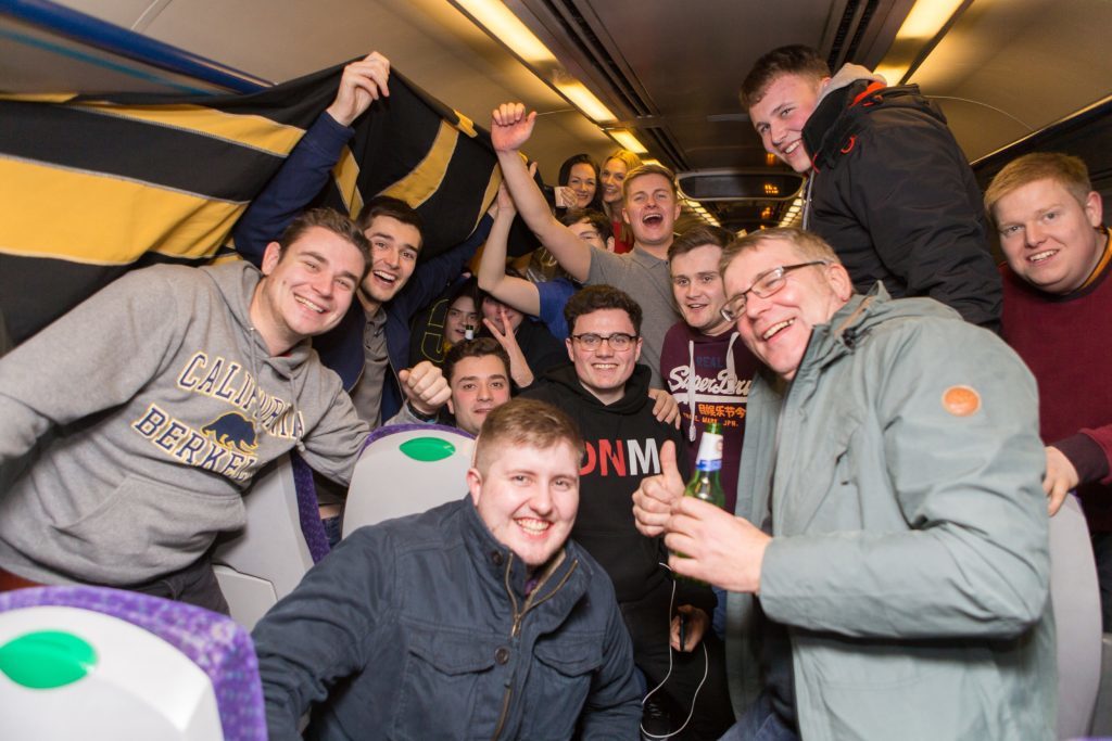 Revellers on the train to Edinburgh Waverley are delighted to meet the rail pastors.