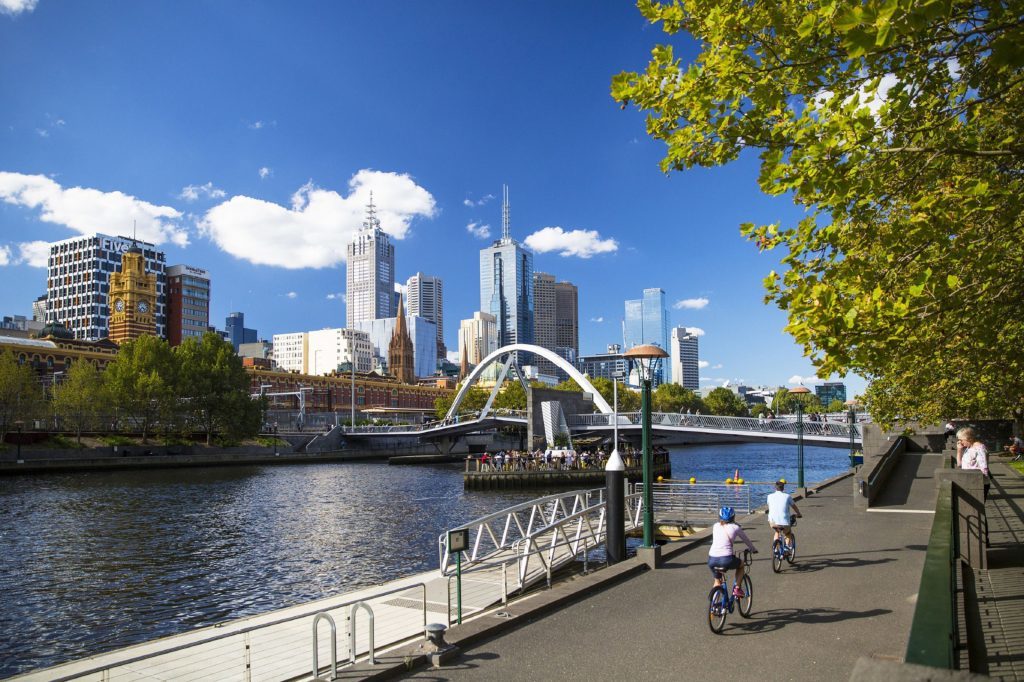 Cyclists riding along Southbank, Melbourne. 