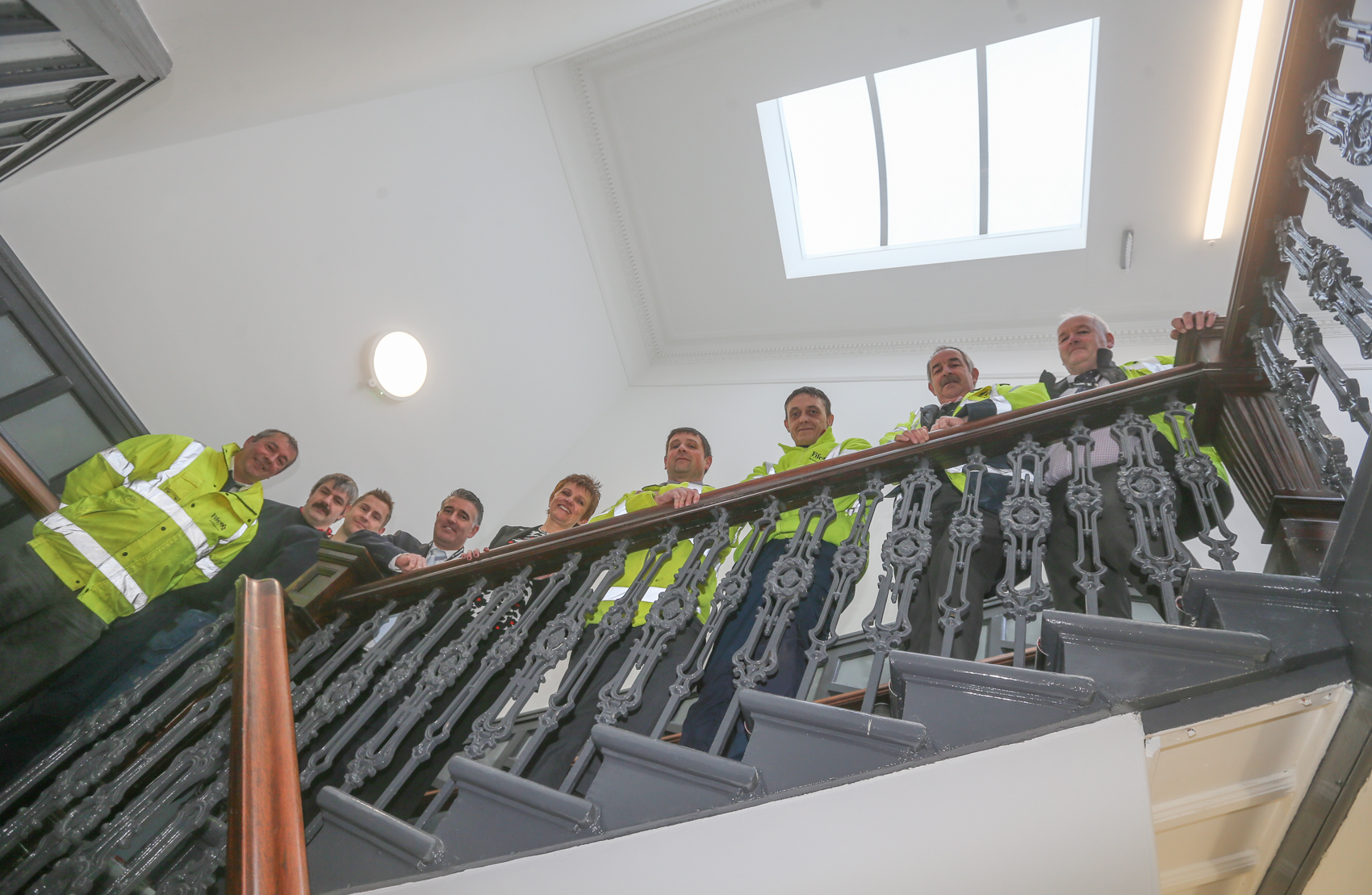 The council team on the staircase of the restored Town House