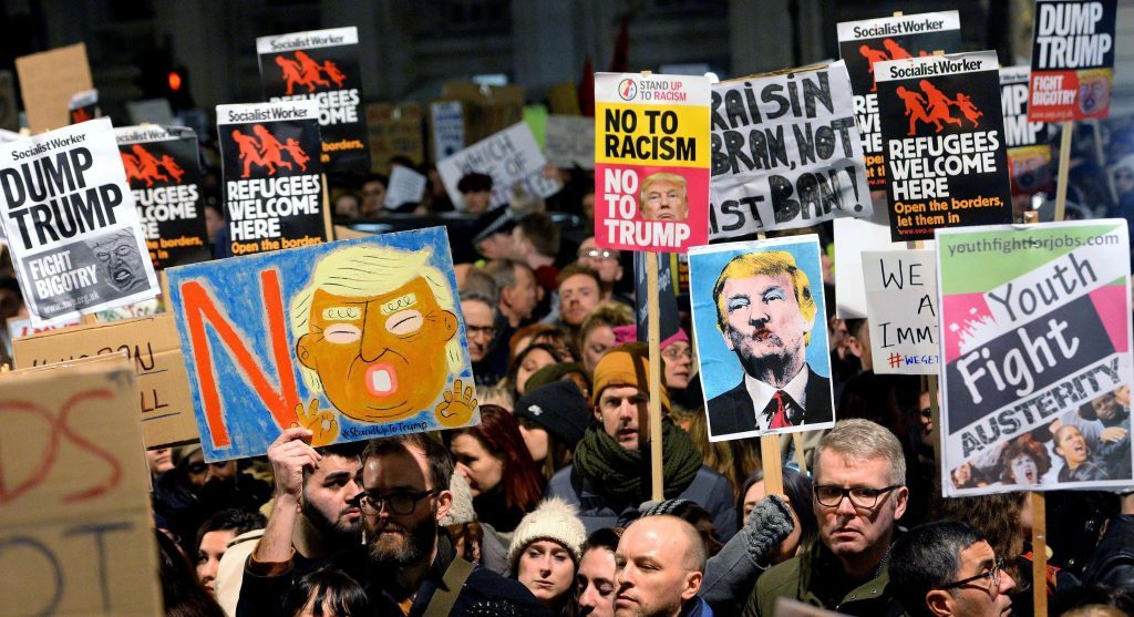 People protest against Donald Trump's controversial travel ban.