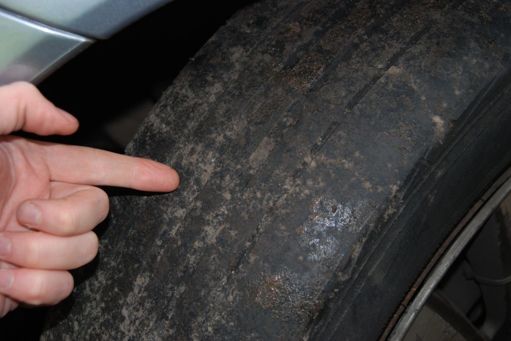 A bald tyre found on a seized car.