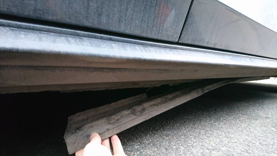 A vehicle allegedly damaged by the bumps.