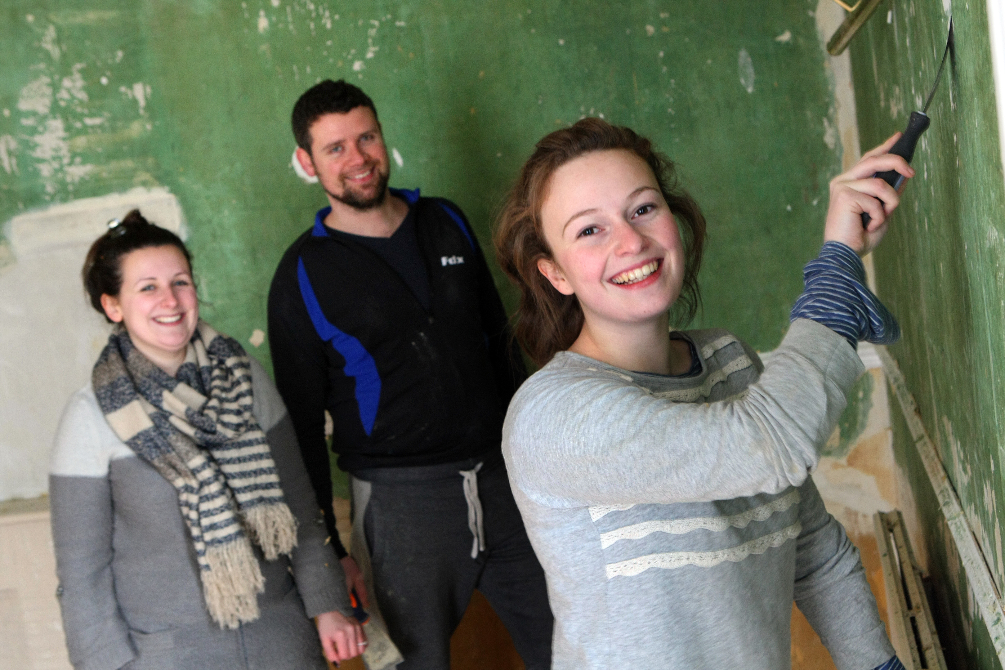 Flora working on the renovations with help from Clare and James Irvine.