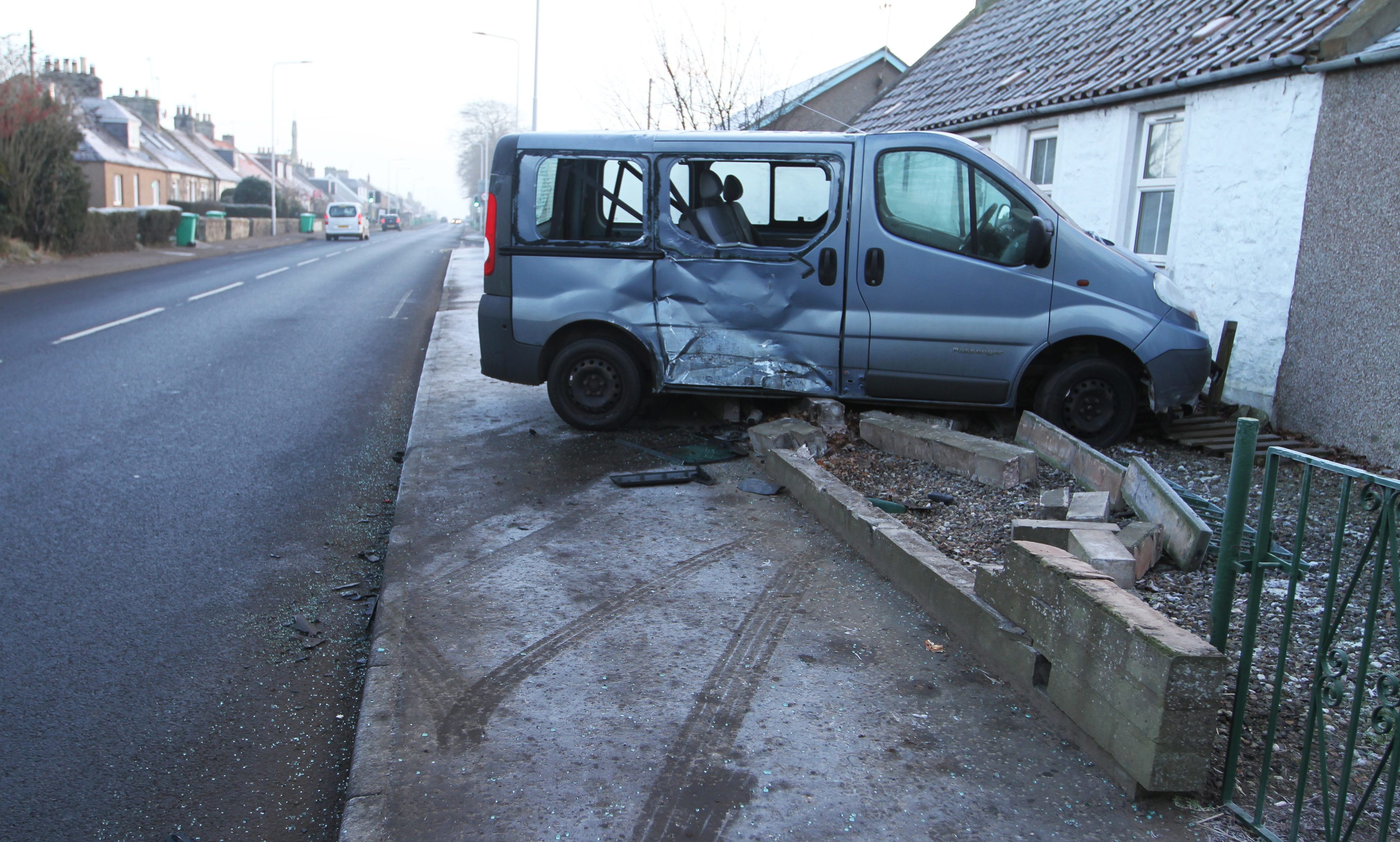 A van in a homeowners front garden.