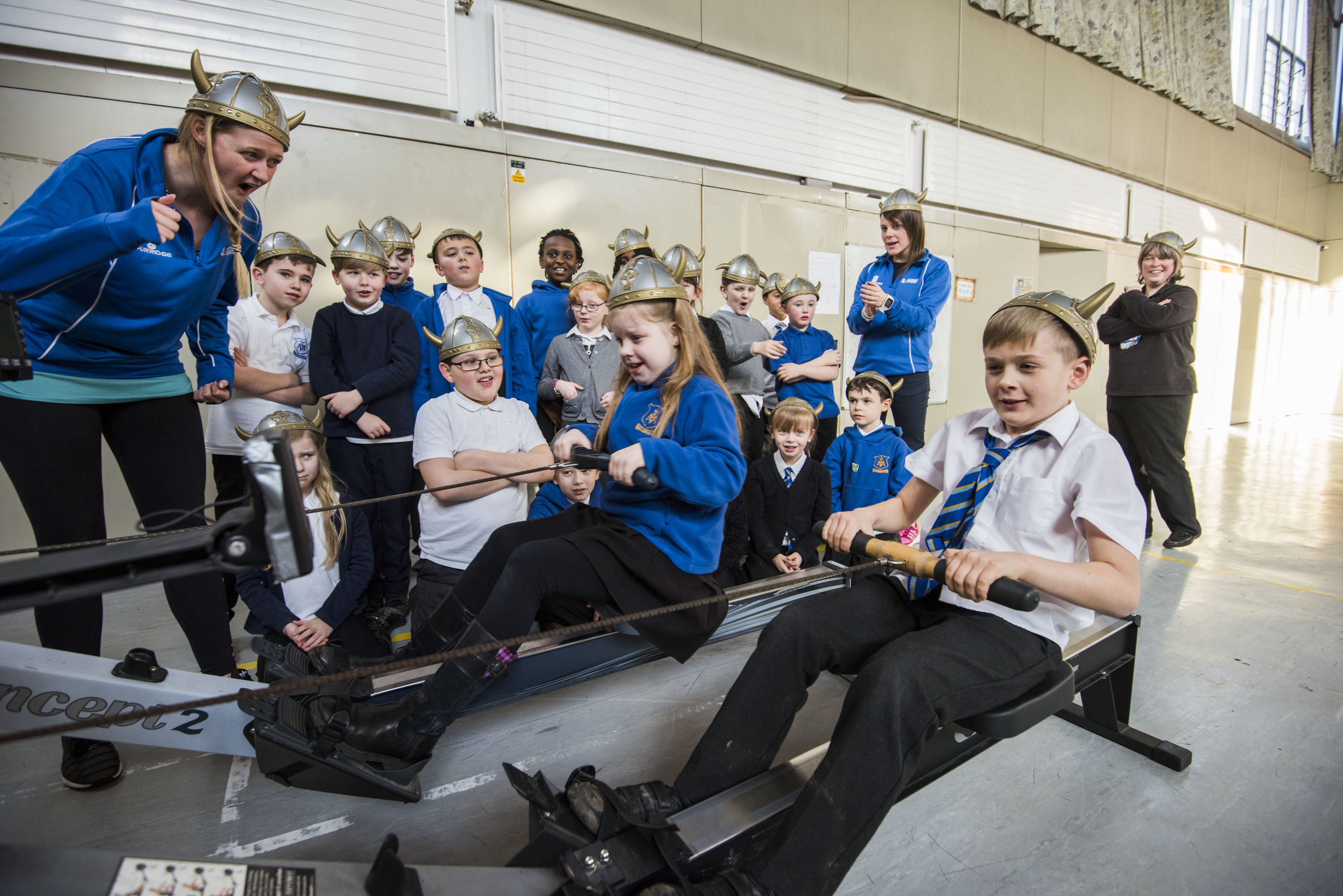 Children from Our Lady's Primary school being taught about Viking history while exercising on a rowing machine.