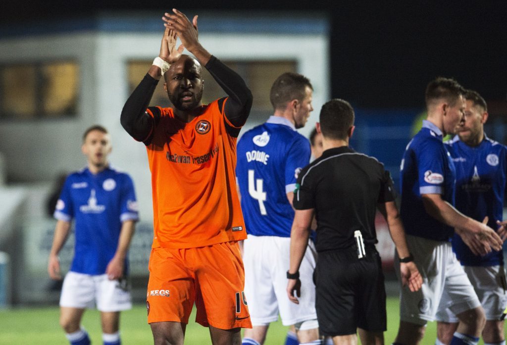 Dundee United's William Edjenguele acknowledges the fans at full time.