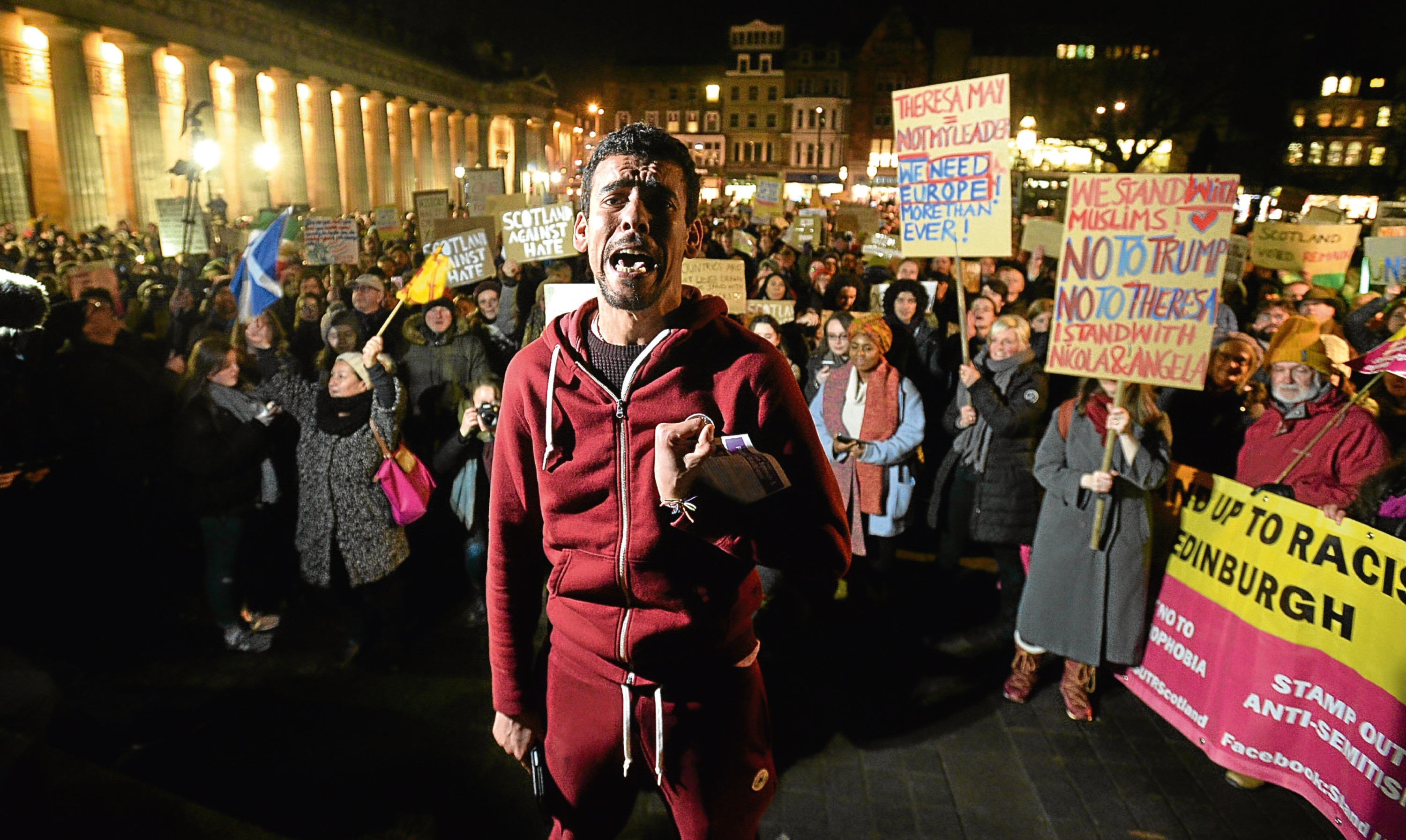 A crowd gathers on the Mound, Edinburgh, to protest against the US travel ban.