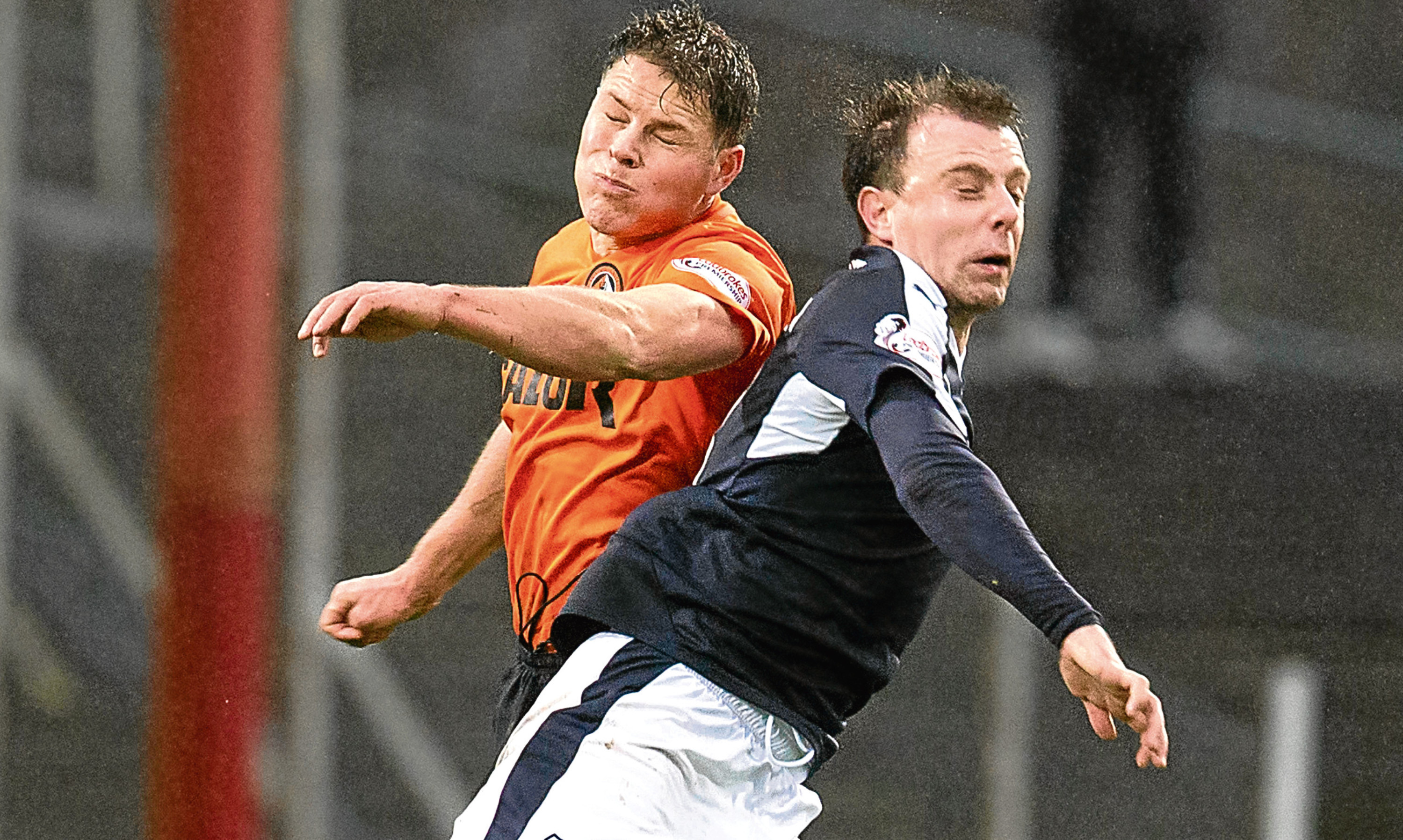 John Rankin and Paul McGowan get stuck in during one of last seasons Dundee derbies, the best fixture in Scottish football, according to Jim.