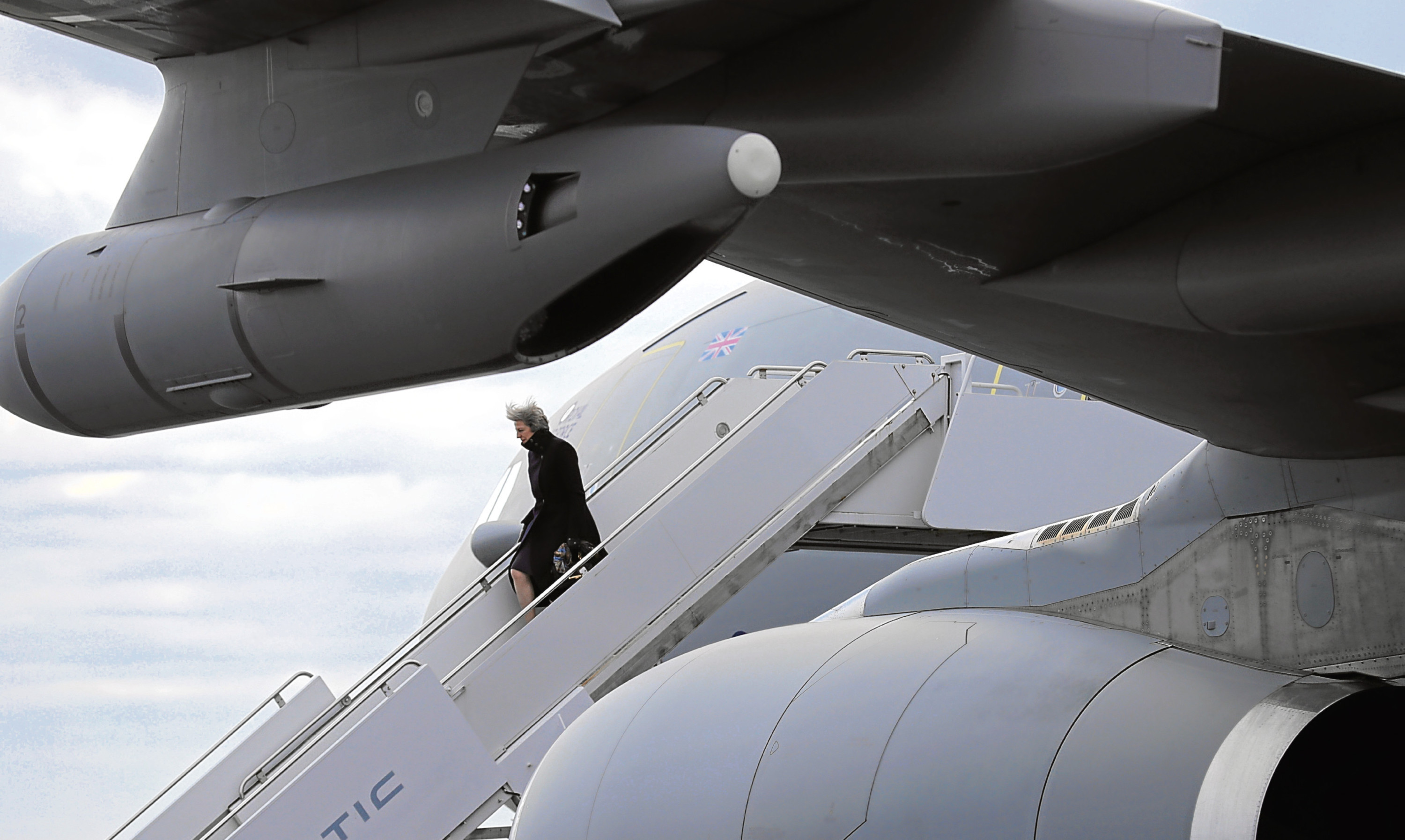 Prime Minister Theresa May departing an aircraft. The Brexit flight will be a long and turbulent one.