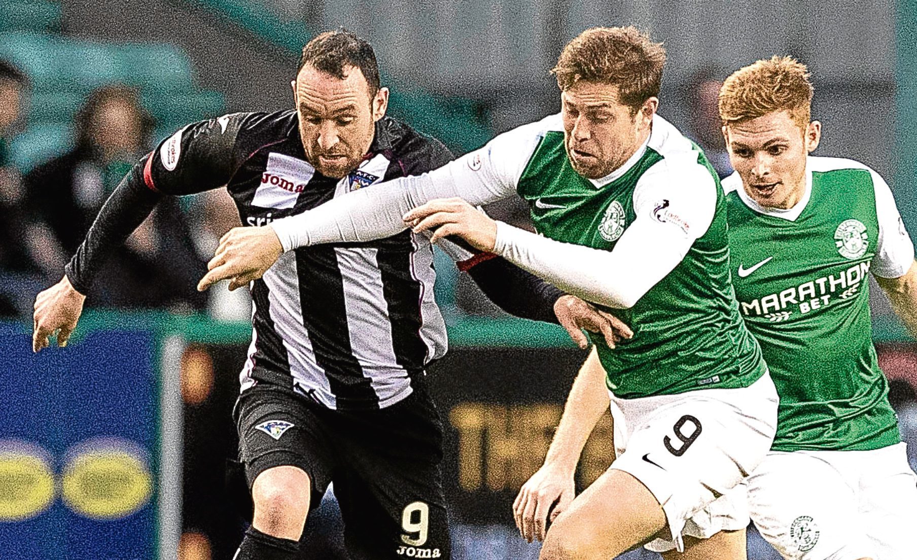 Dunfermline's Michael Moffat and Hibernian's Grant Holt.