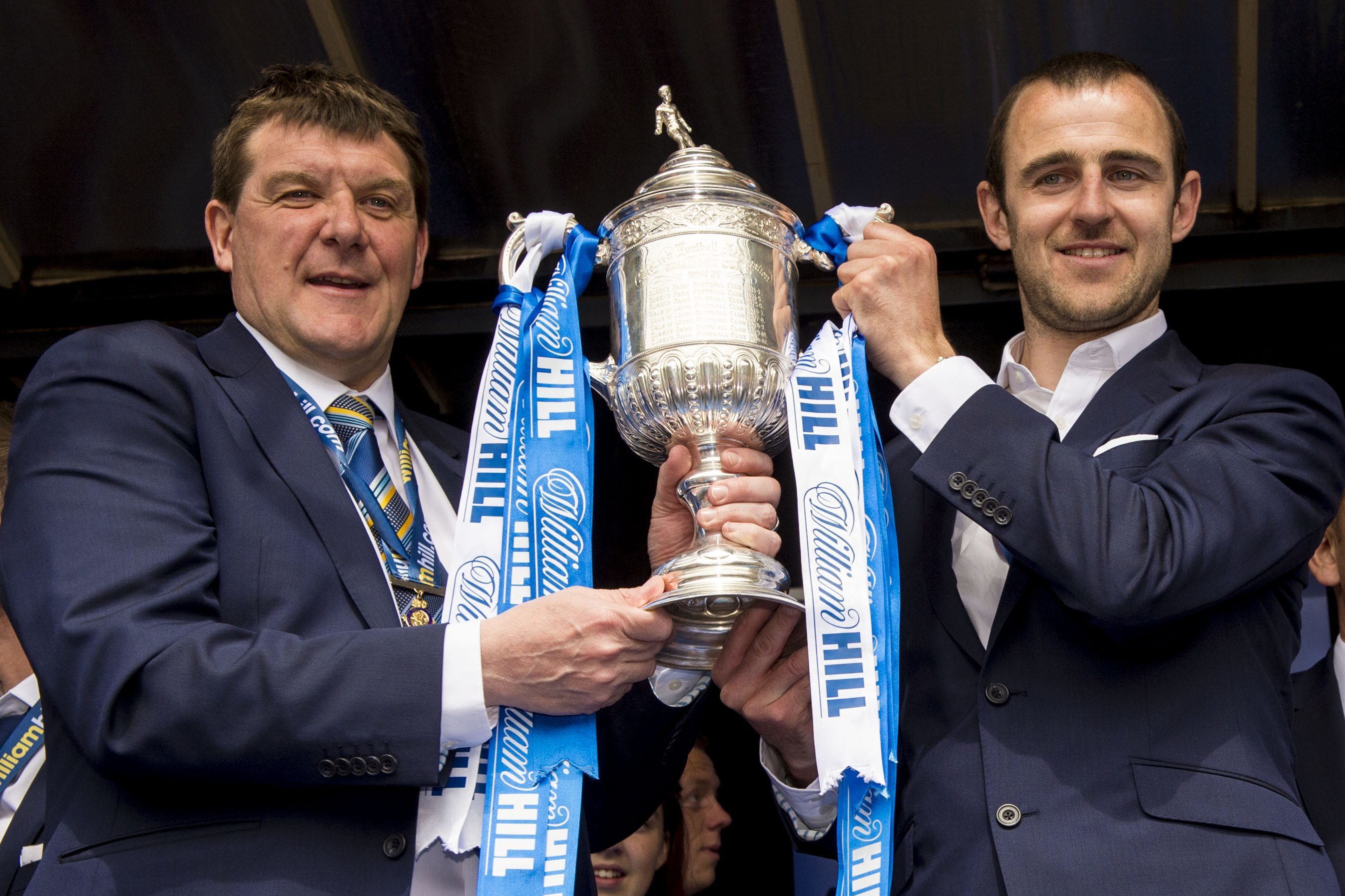 Tommy Wright with Dave Mackay after winning the Scottish Cup.