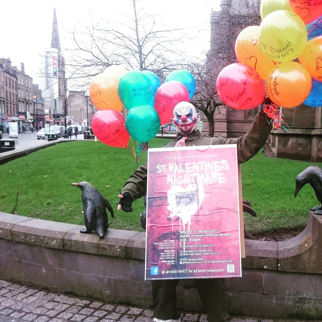 A creepy clown doing publicity work for the event at Dundee City Centre.