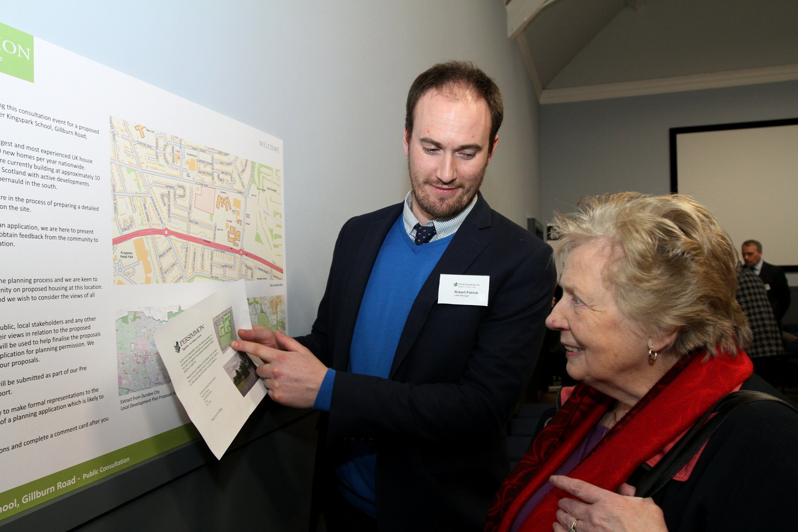 Land manager Robert Patrick talks campaigner Peggy George through the plans.