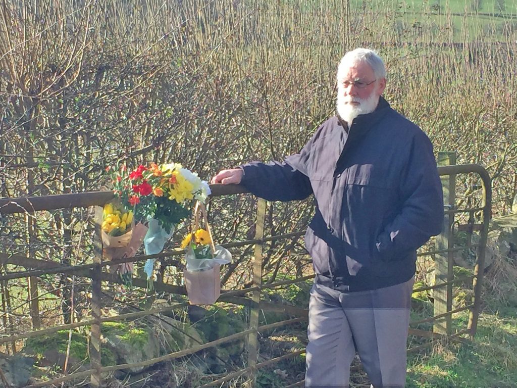 Councillor Bob Ellis surveys the tributes left at Milton of Drimmie.