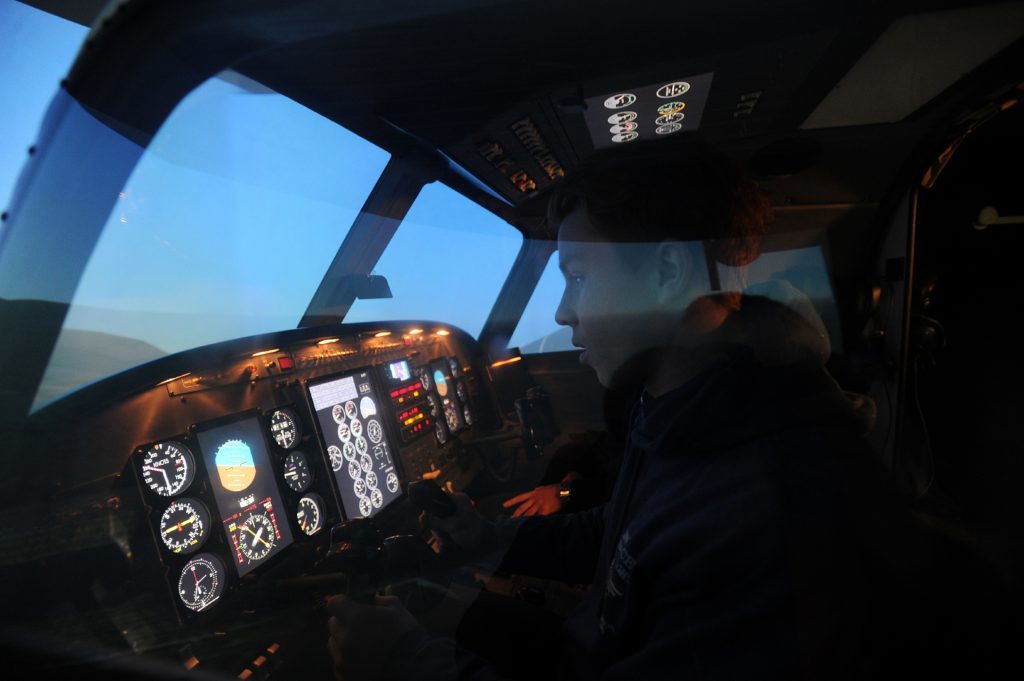 Flying Ace Scott Paddon in the flight simulator.
