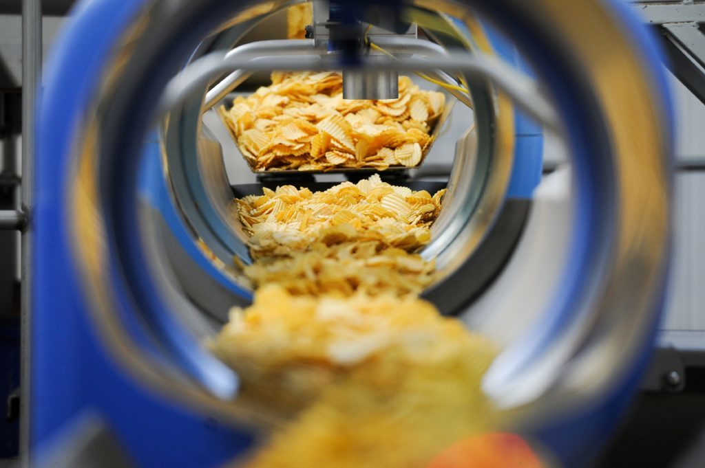 Equipment used to deliver the cooked crisps to the appropriate production line.