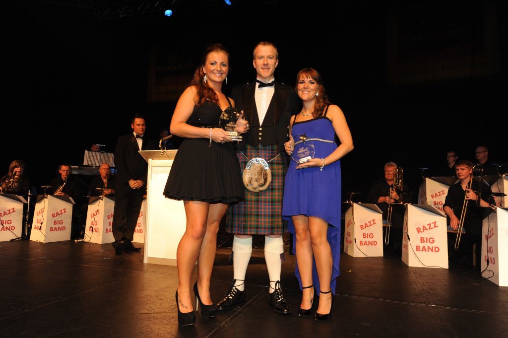 The Courier's Michael Alexander presents an award to Kirsty Yeoman and Kelly Owens at the Kingdom FM Local Hero Awards in 2013