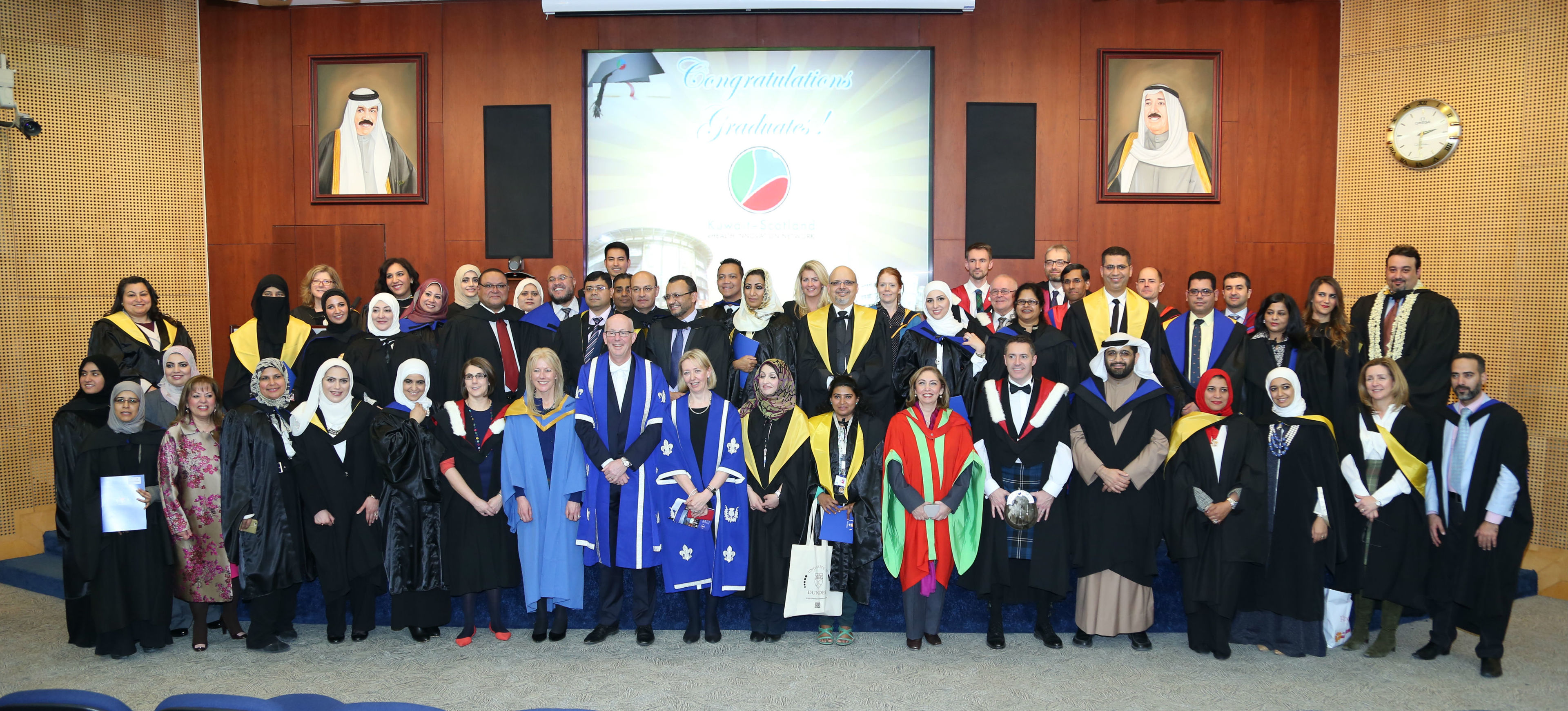 Graduates celebrating their degrees from Dundee University in Kuwait.