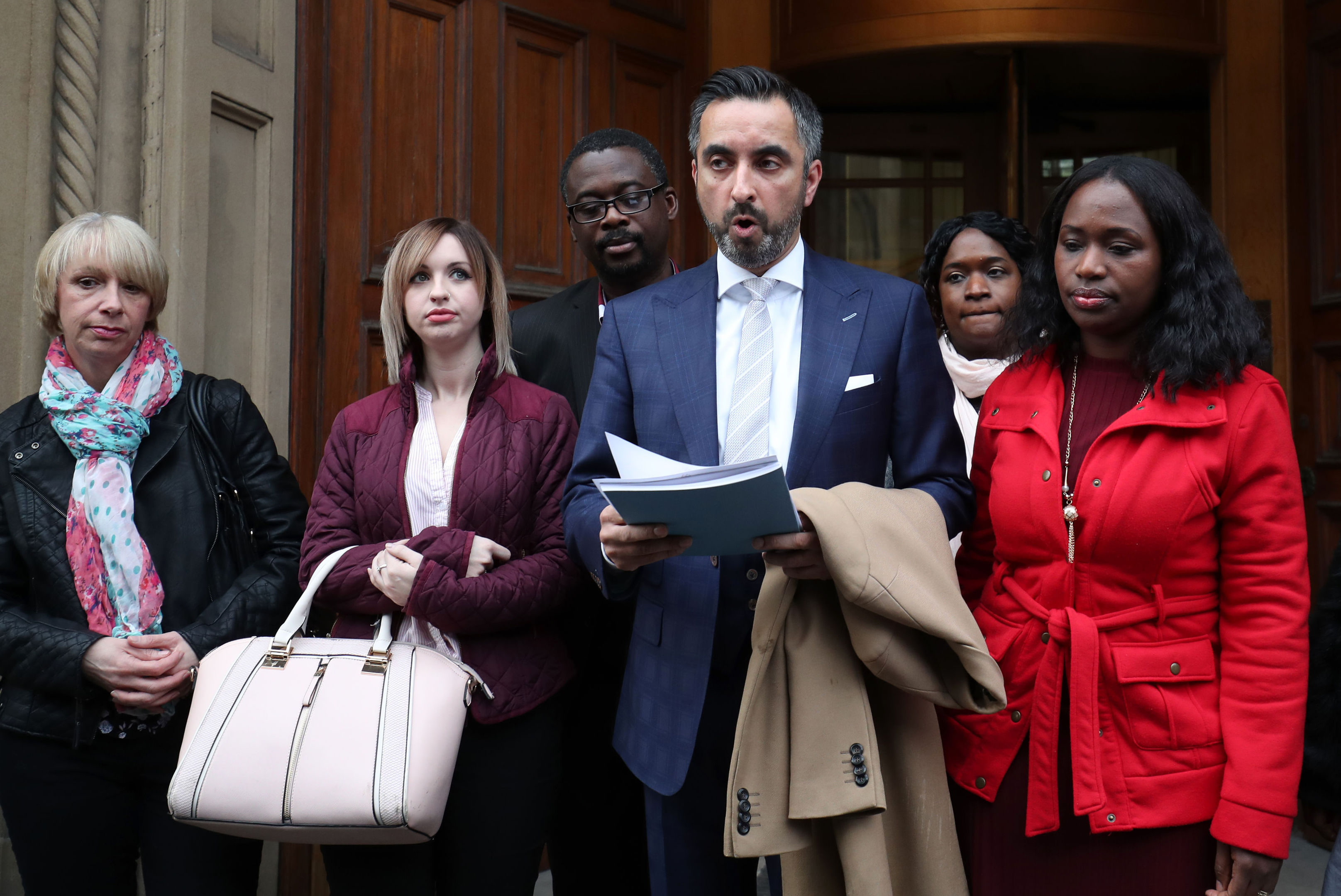 Solicitor Aamer Anwar reads a statement to the media outside the Crown Office in Edinburgh after family members of the late Sheku Bayoh met the Lord Advocate.