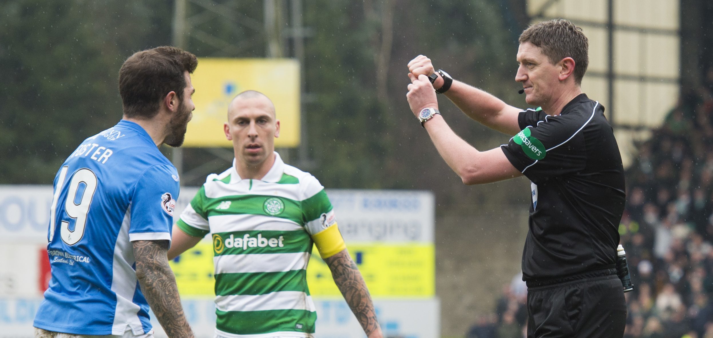 Referee Craig Thomson makes his penalty decision.