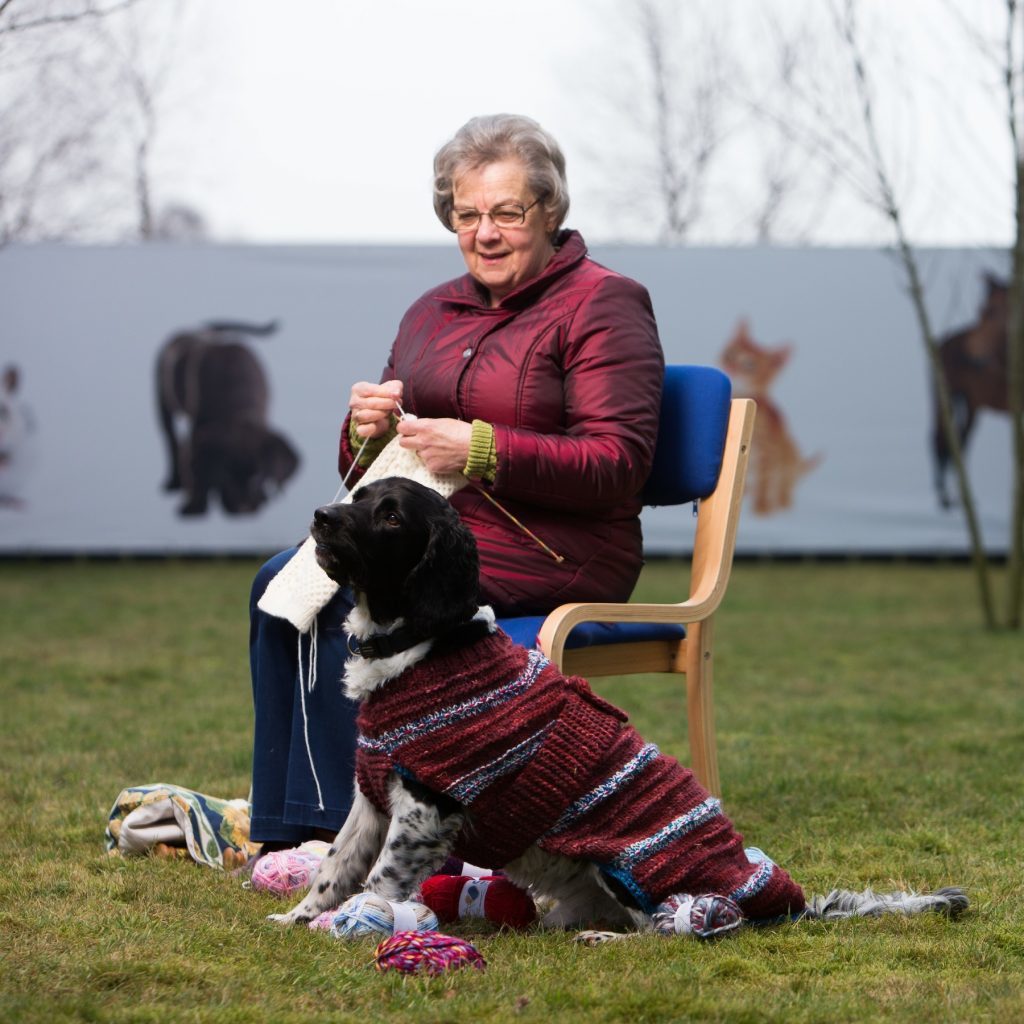 One of the knitters with rescue dog Barney.