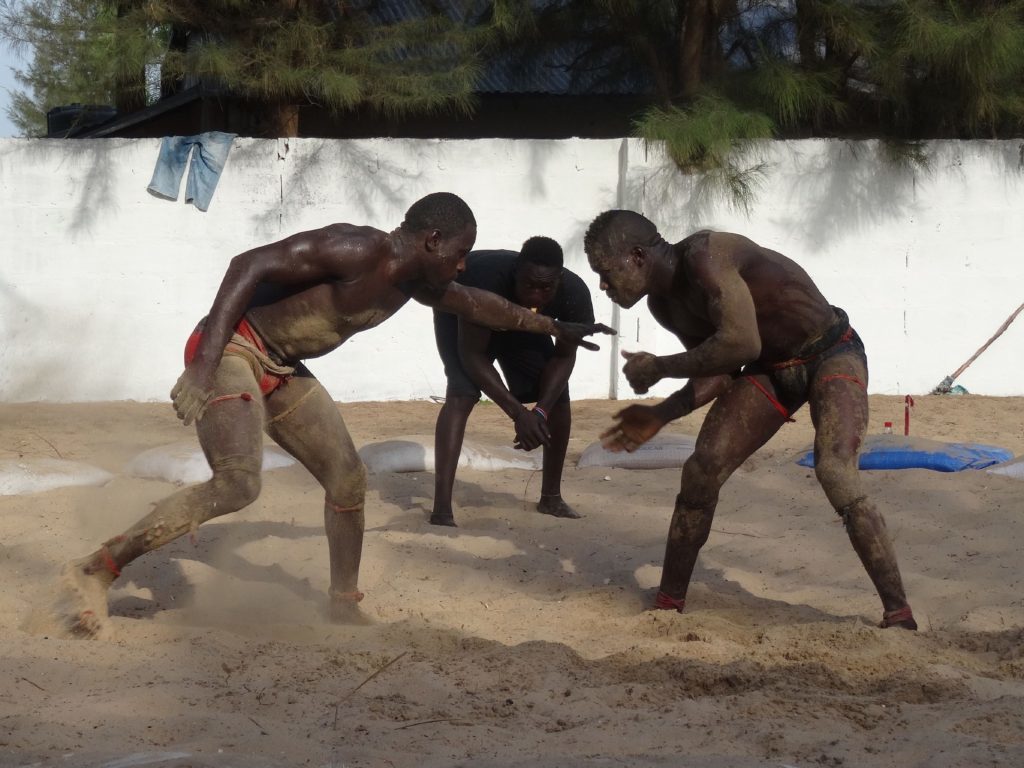 Gambian wrestlers prepare to grapple in Sanyang. 