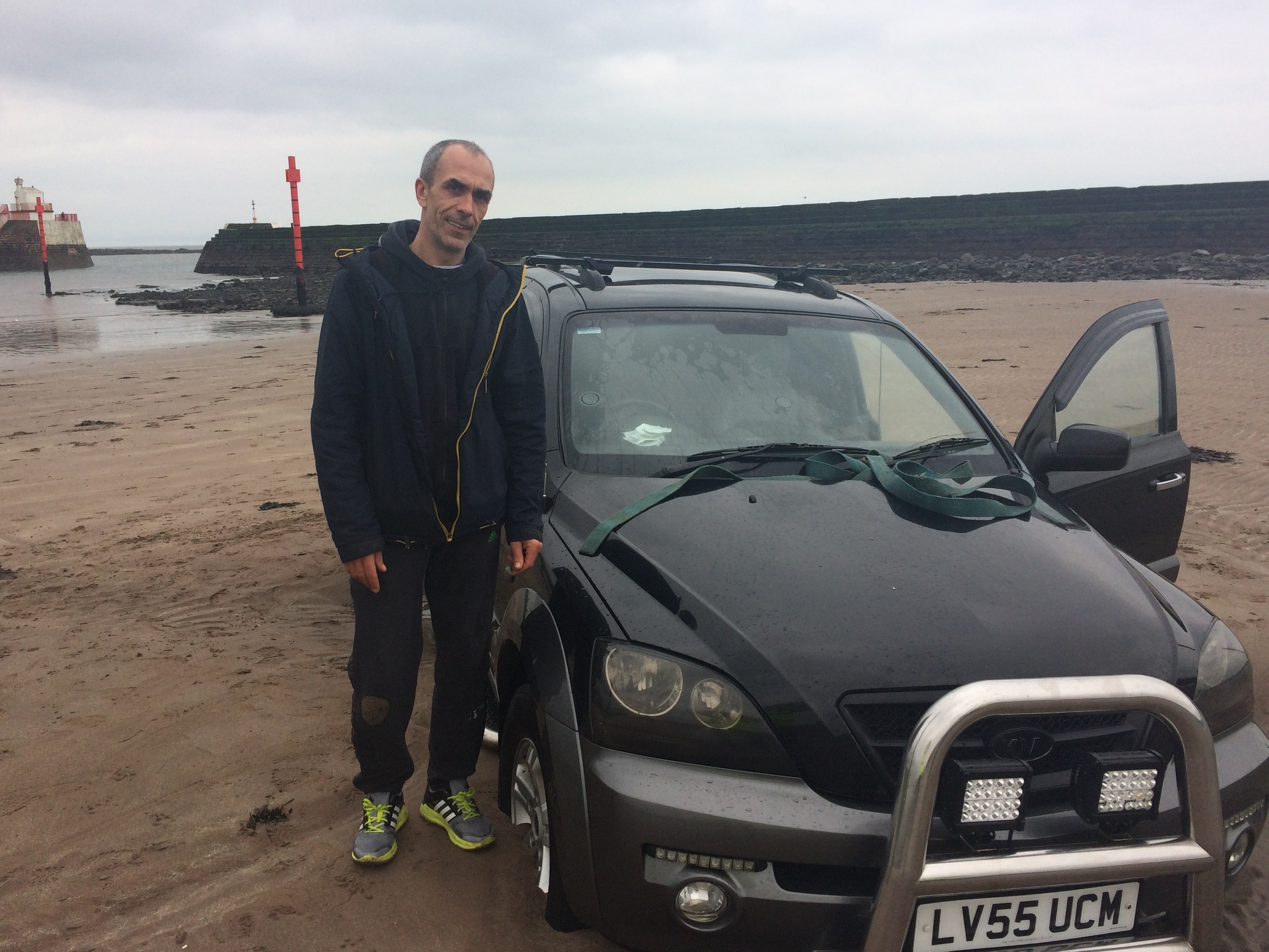 Nikolaj Saparenko with his waterlogged Kia Sorrento