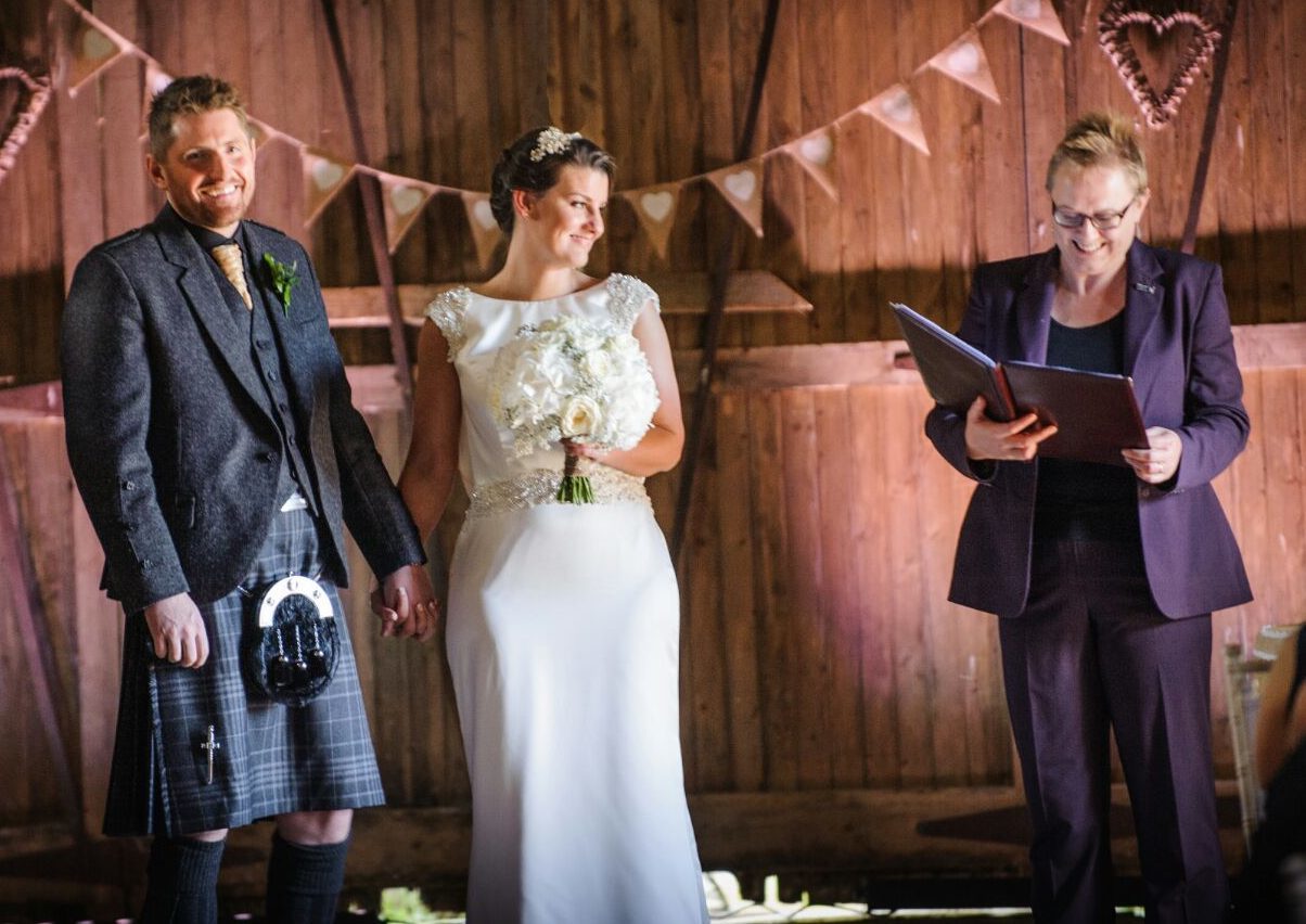 Celebrant Jane Bechtel conducting the wedding of Leah and Andrew Livingston.