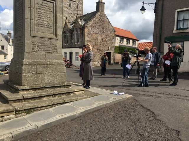 Filming a scene by the war memorial in Auchtermuchty. 