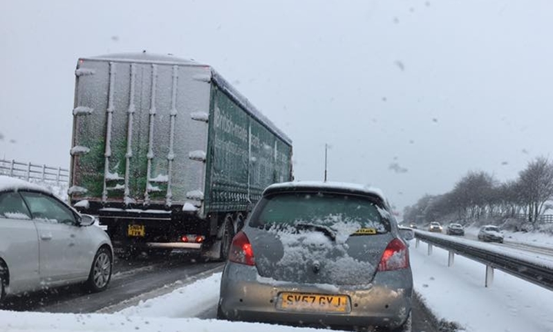 Cars have been stationary on the M80 outside Glasgow for over two hours as gritters struggle to reach the area.