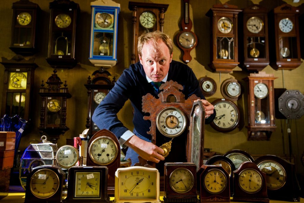 Nick Burns with some of the clocks up for auction.