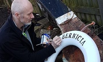 Richard Wemyss prepares a lifebelt for the stage for his musical memorial to the lost Bernicia crew