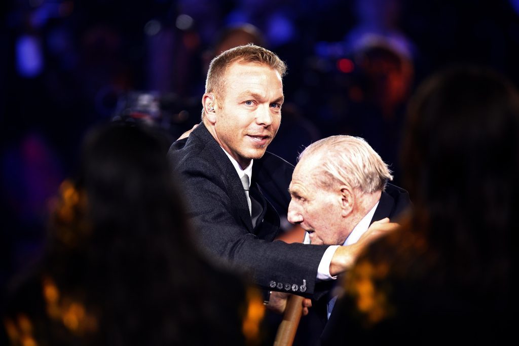 Sir Chris Hoy embracing his uncle Andy Coogan during the 2014 Commonwealth Games opening ceremony in Glasgow.