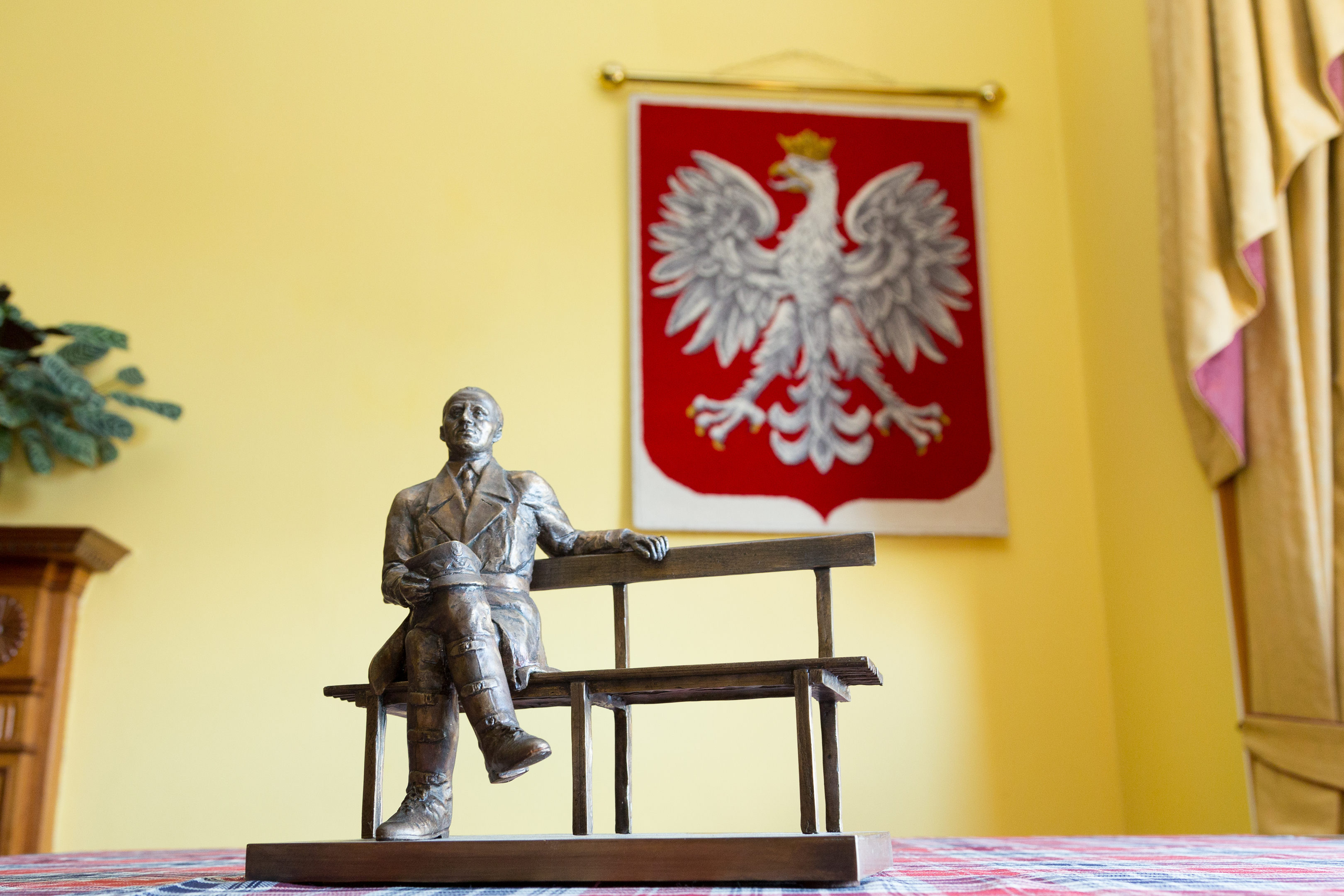 The maquette of General Stanislaw Maczek laid on Polish tartan.