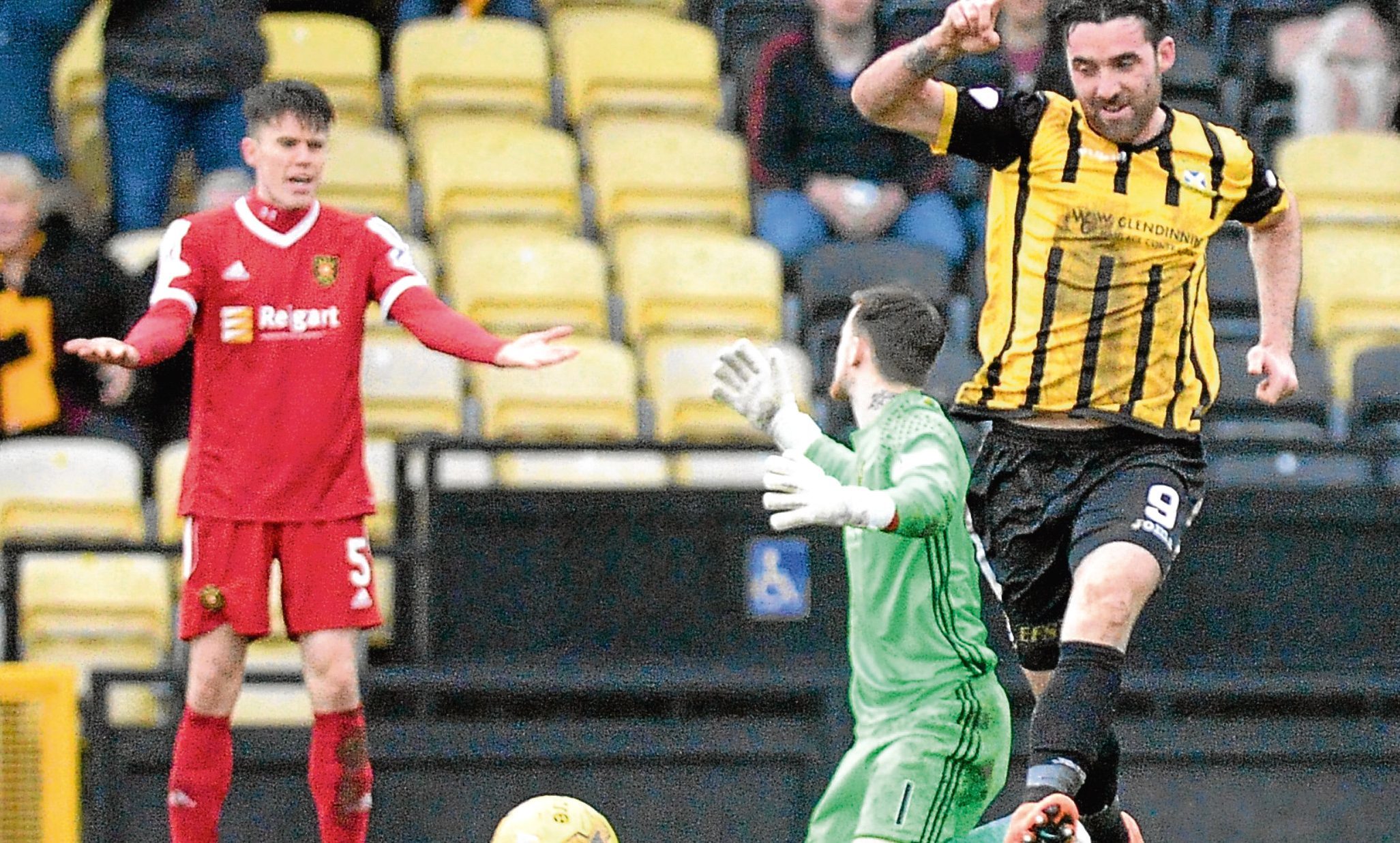 Chris Duggan scores as keeper Ross Stewart and Ross Dunlop can only look on.