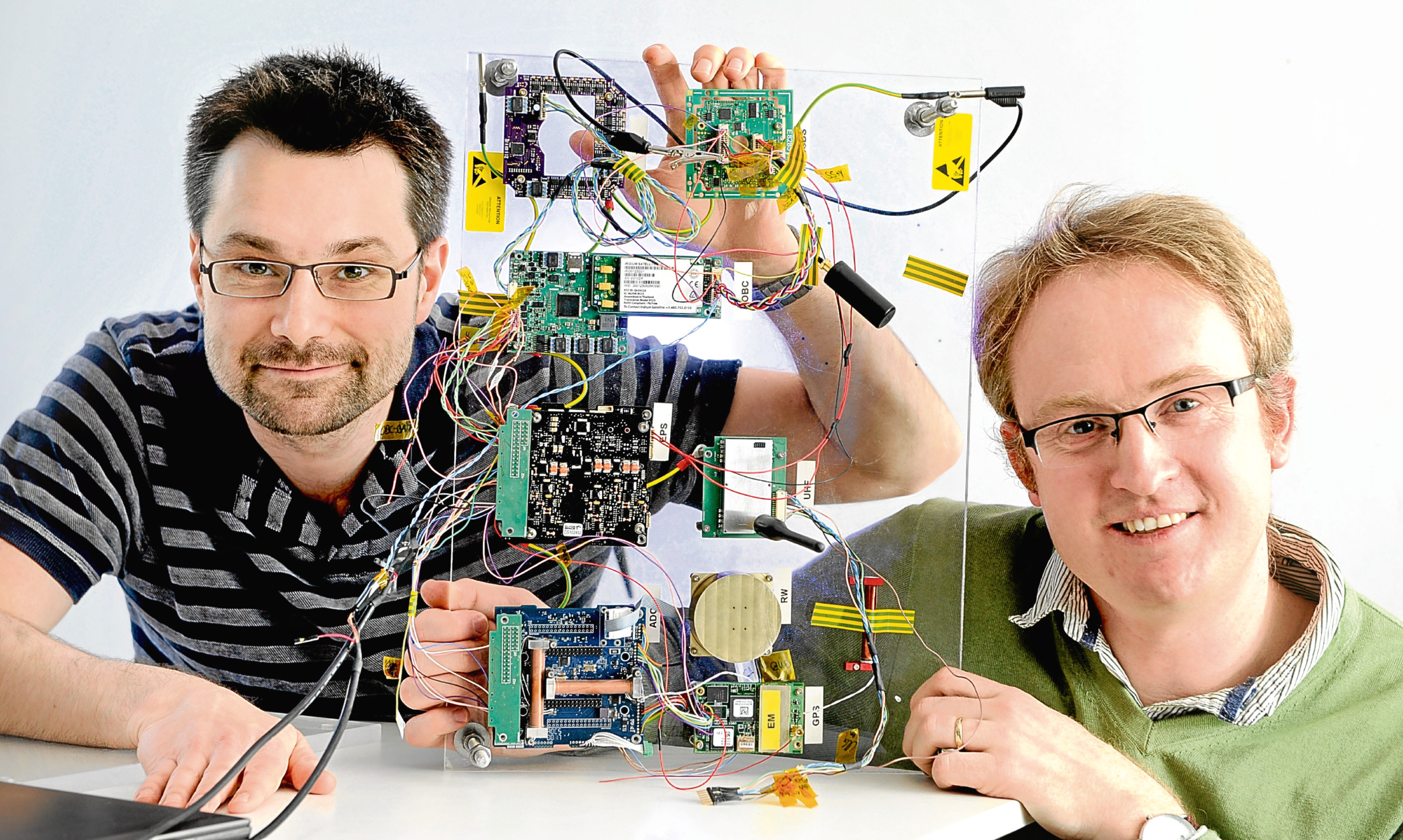 Bright Ascension founding director Dr Peter Mendham (right) with technical director, Dr Mark McCrum, and a satellite launch control board.