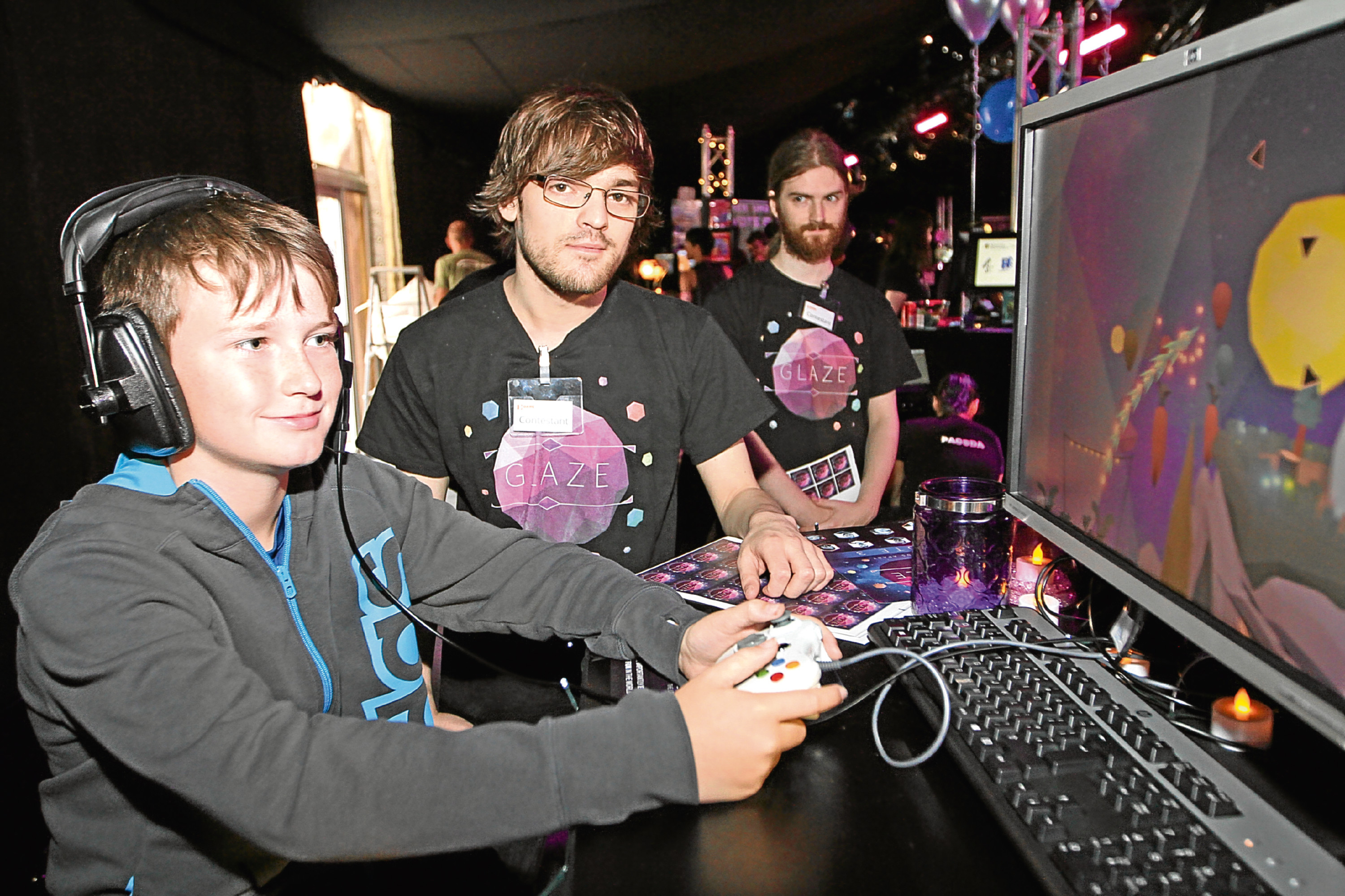 Young  fan Ross Craik checks out a new game at the 2016 Dare Proptoplay festival in Dundee