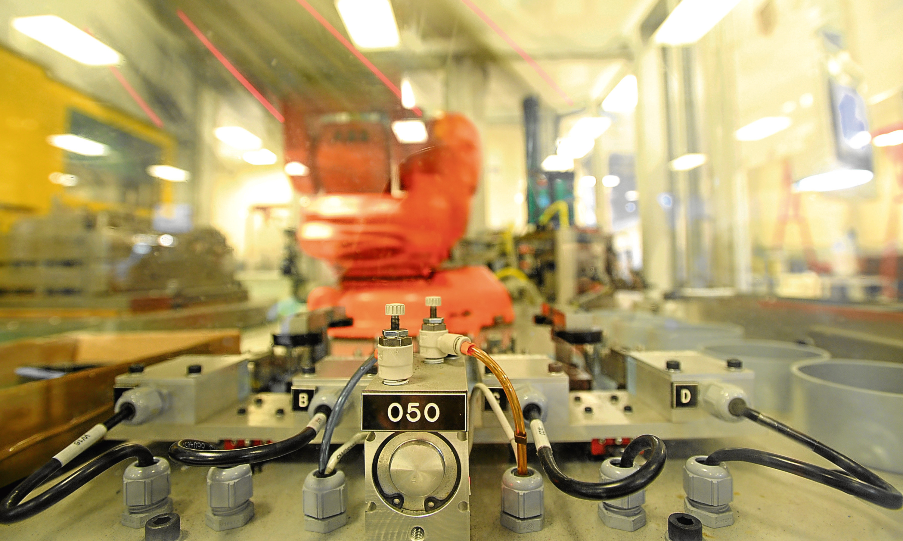 A high speed production robot in action at Angus engineering group Interplex PMP.