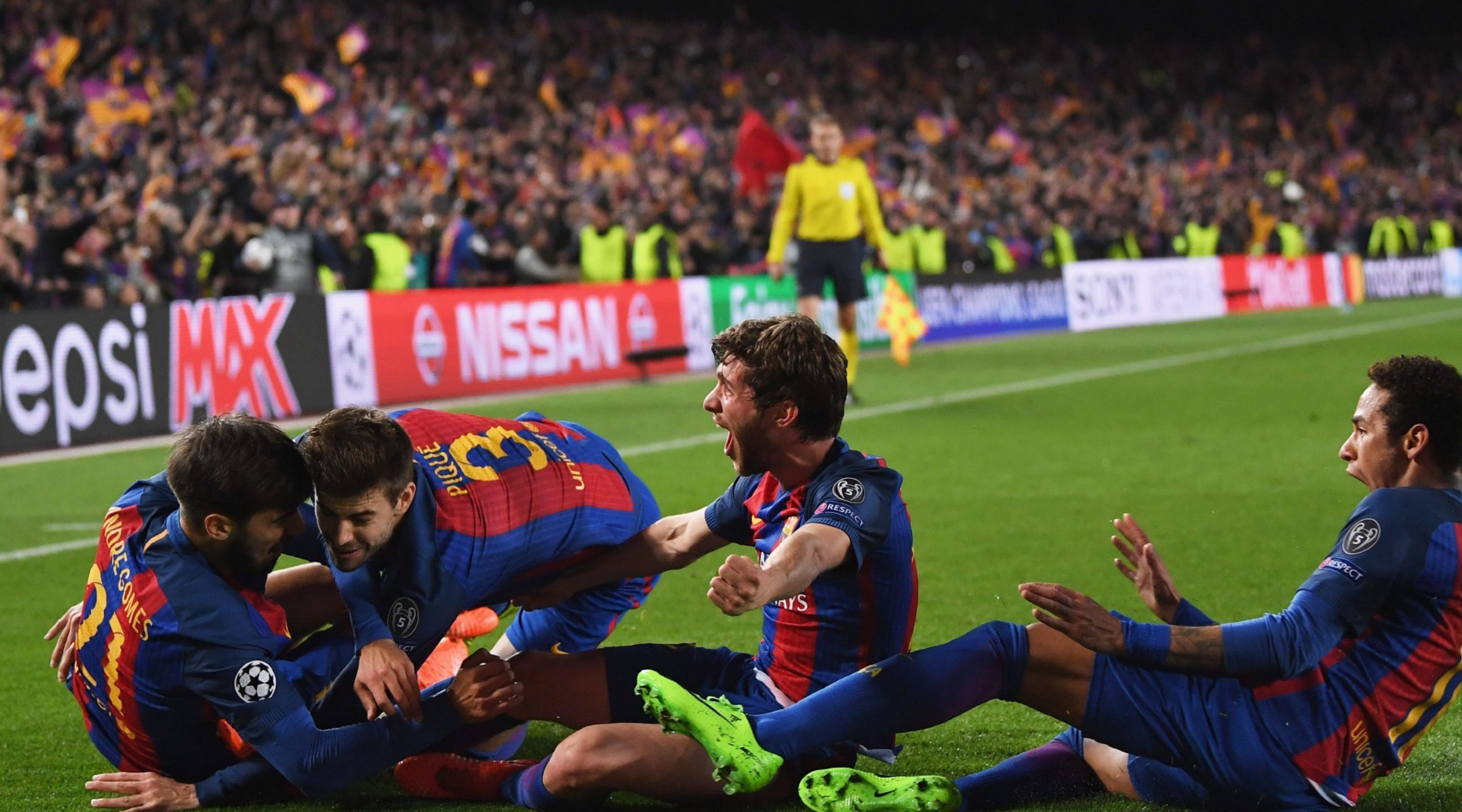Barcelona players celebrate their incredible comeback.