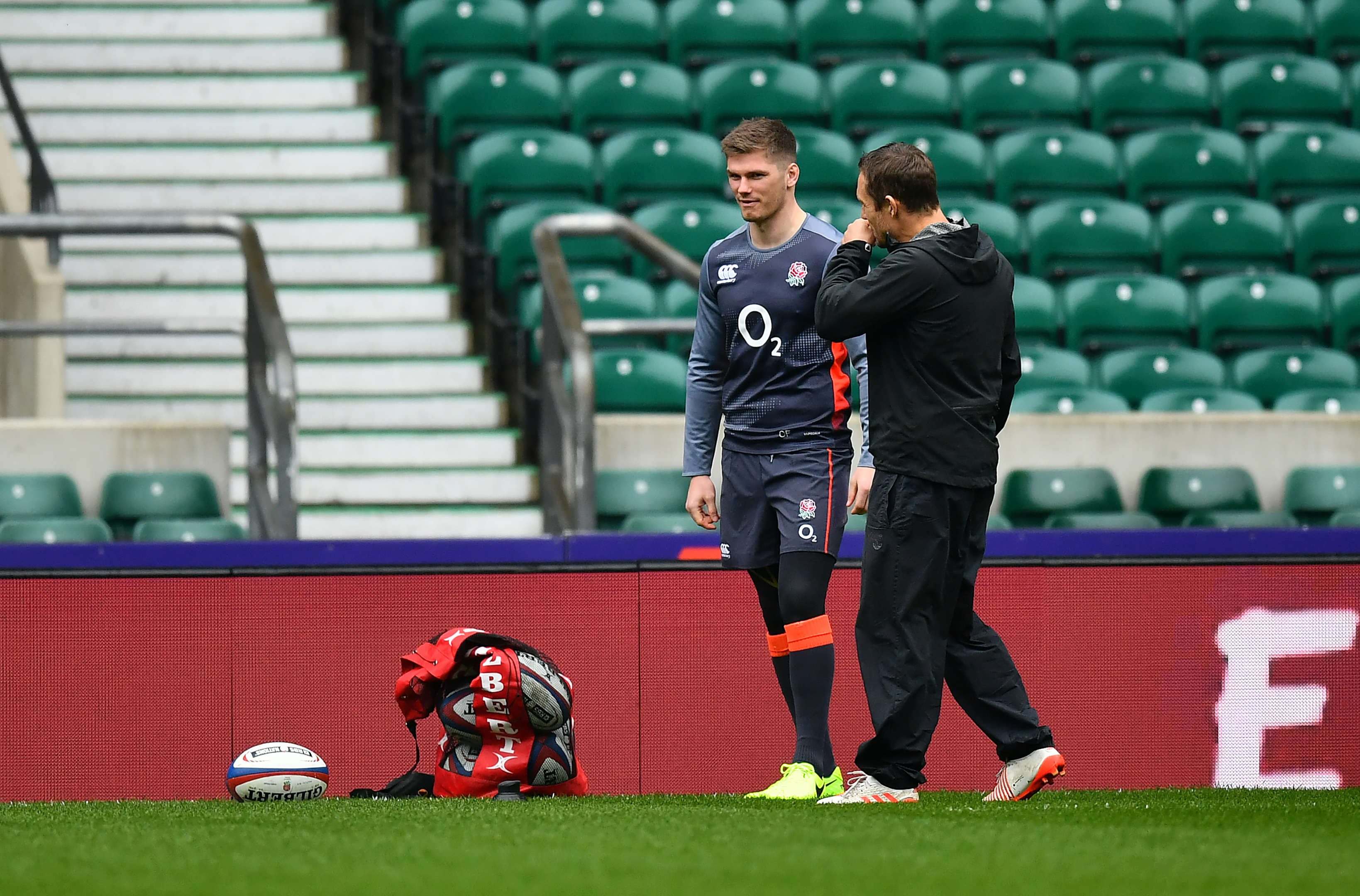 Owen Farrell, seen at Twickenham yesterday with coach Jonny Wilkinson, took no part in the final training session.